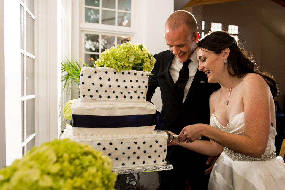 Kevin and Ellery cut their wedding cake during their