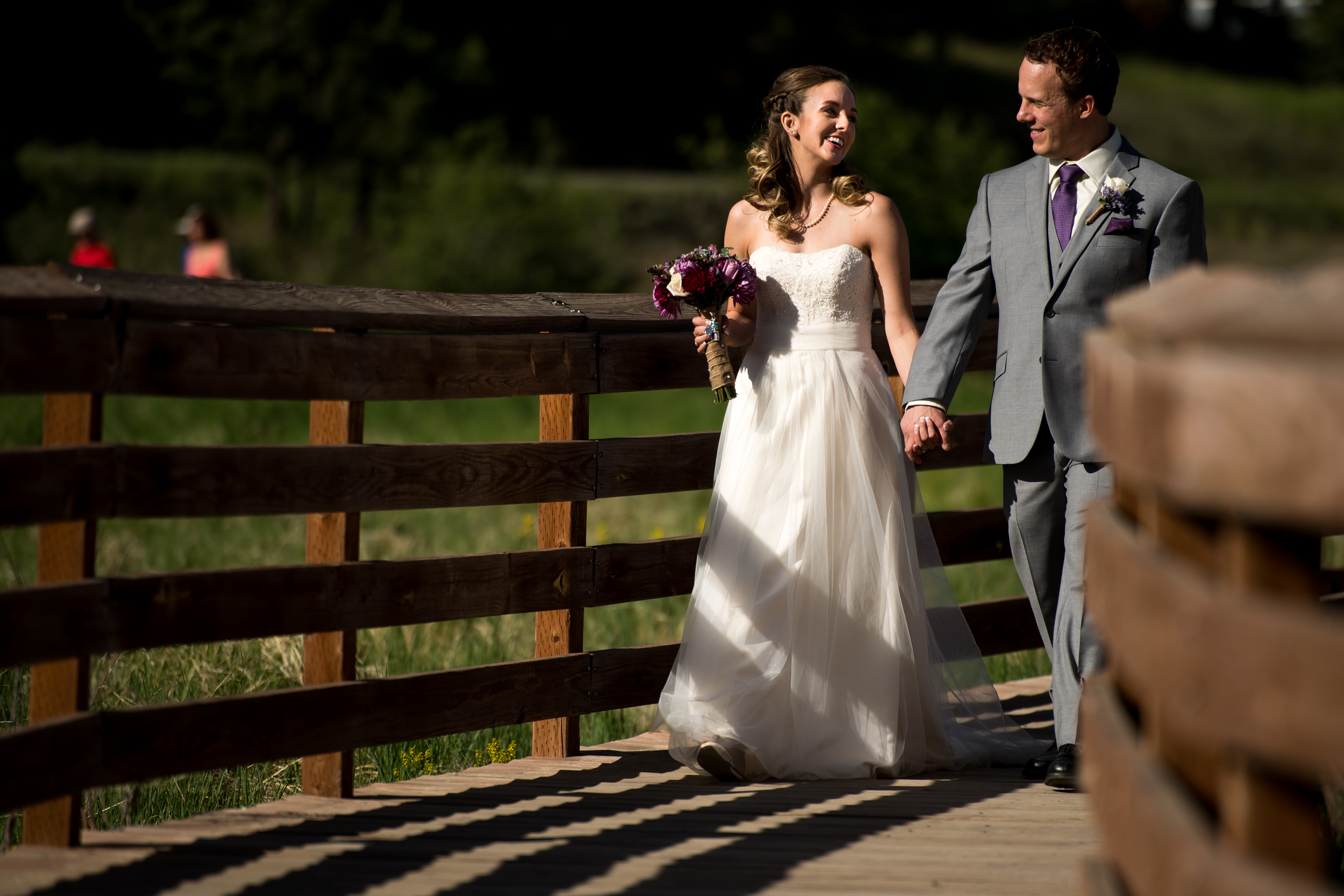 Evergreen Lake House wedding pictures of bride and groom holding hands