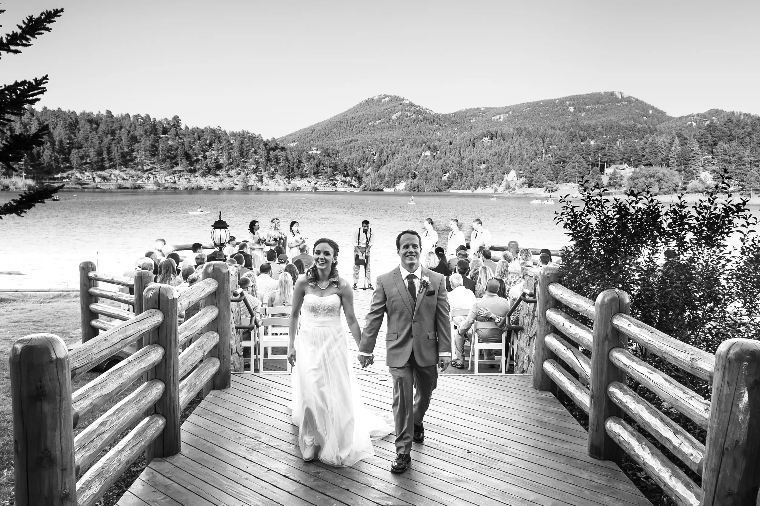 Evergreen Lake House wedding pictures of bride and groom walking down the aisle after their wedding