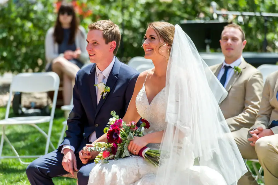 Smiling during an Our Lady of Lourdes Denver wedding