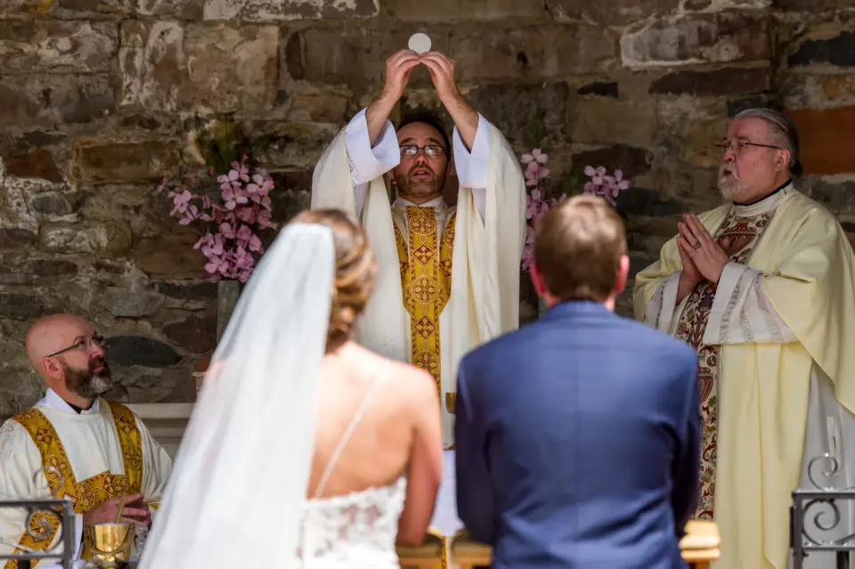 Celebrating Mass during an Our Lady of Lourdes Denver wedding.