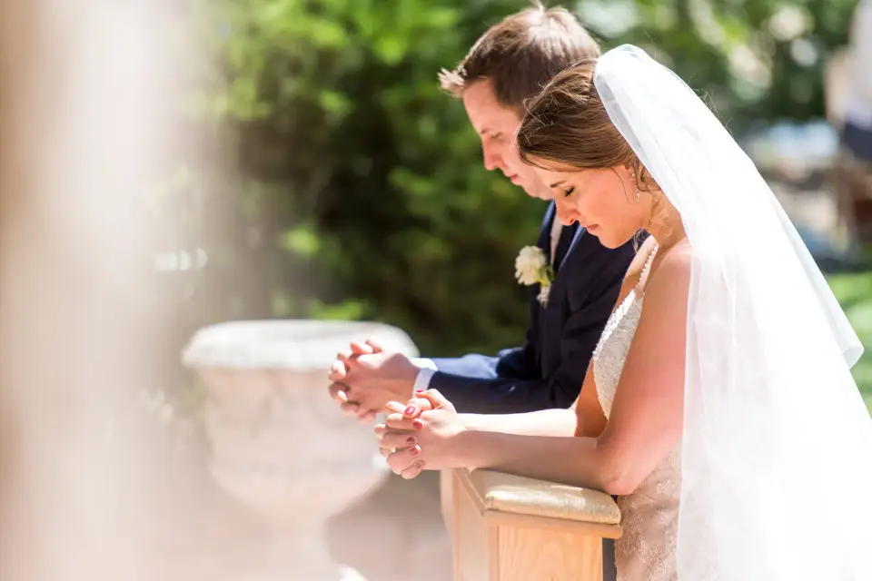 Celebrating Mass during an Our Lady of Lourdes Denver wedding.