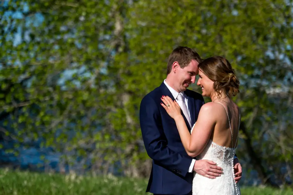 Bride and groom pose during a backyard wedding in Colorado