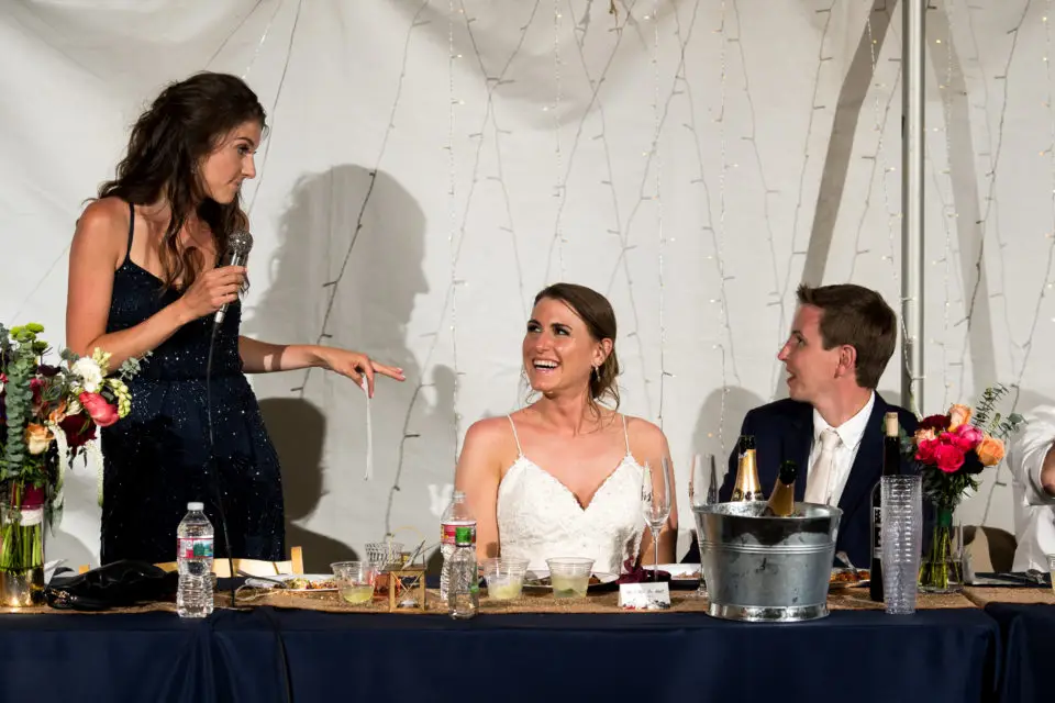 Bride and groom toast during a backyard wedding in Colorado