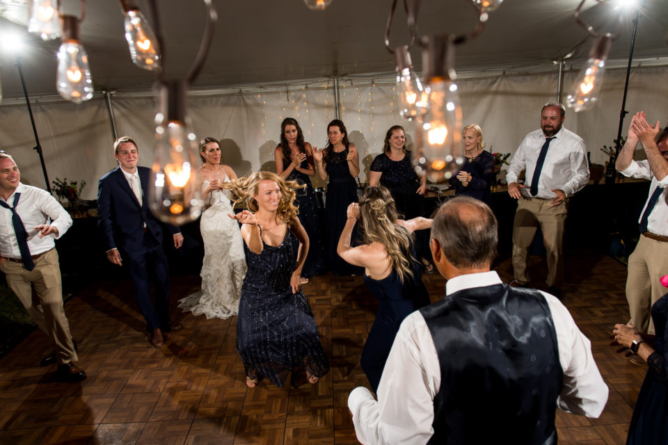 Dancing under the tent during a backyard wedding in Colorado