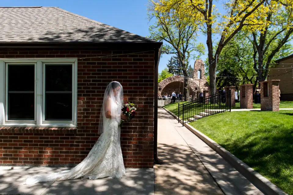 Gina waits before her wedding at Our Lady of Lourdes Denver