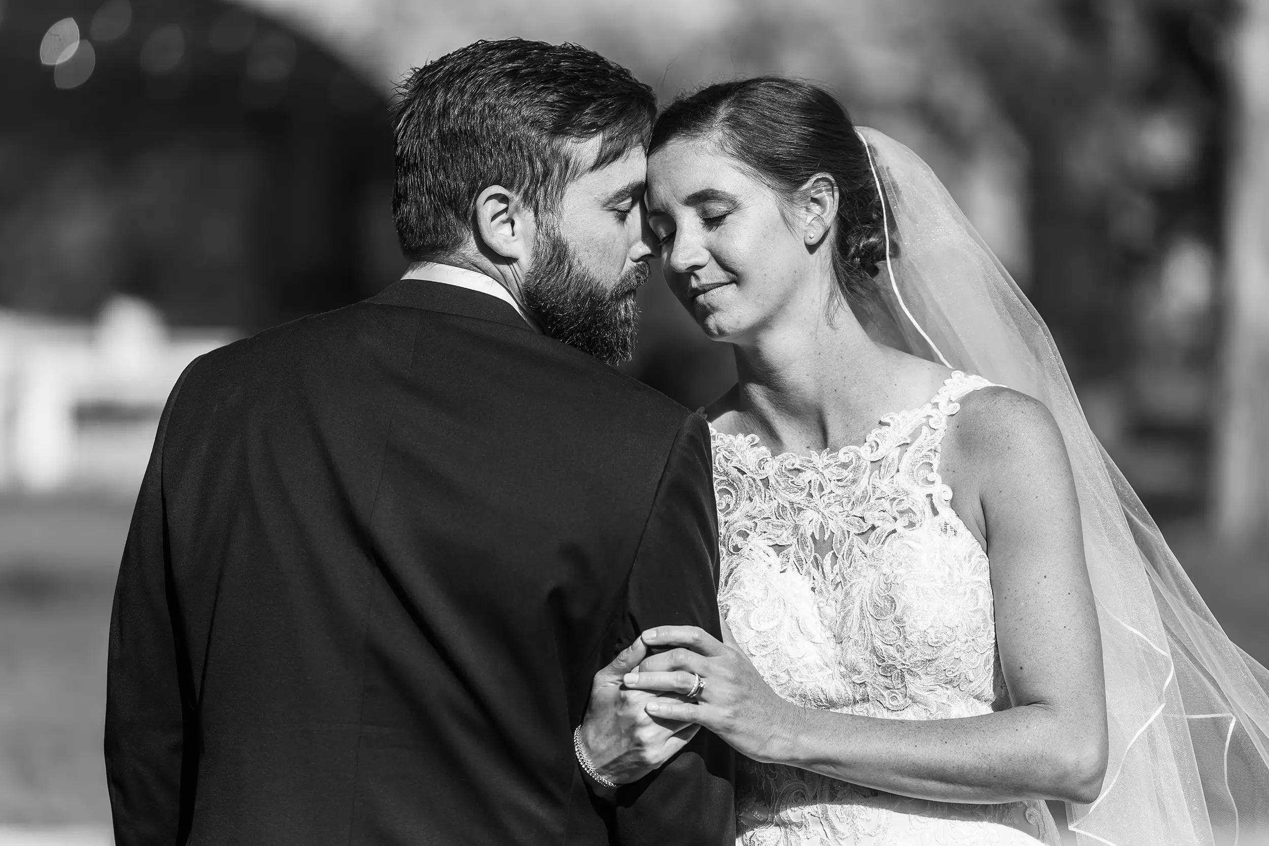 Couple poses after their wedding at Our Lady of Lourdes Catholic Church in Denver, Colorado.