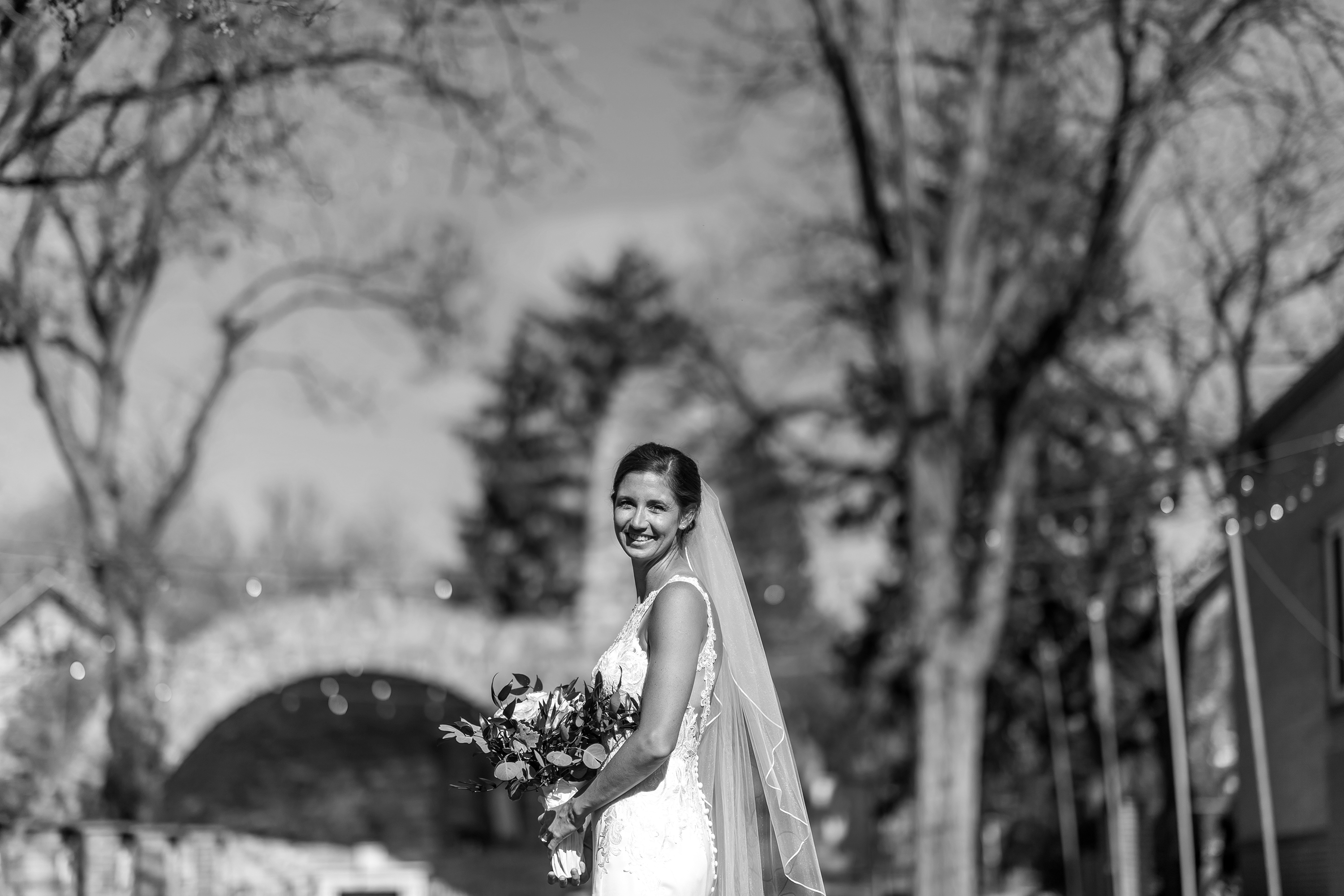 Bride poses after her wedding at Our Lady of Lourdes Catholic Church in Denver, Colorado