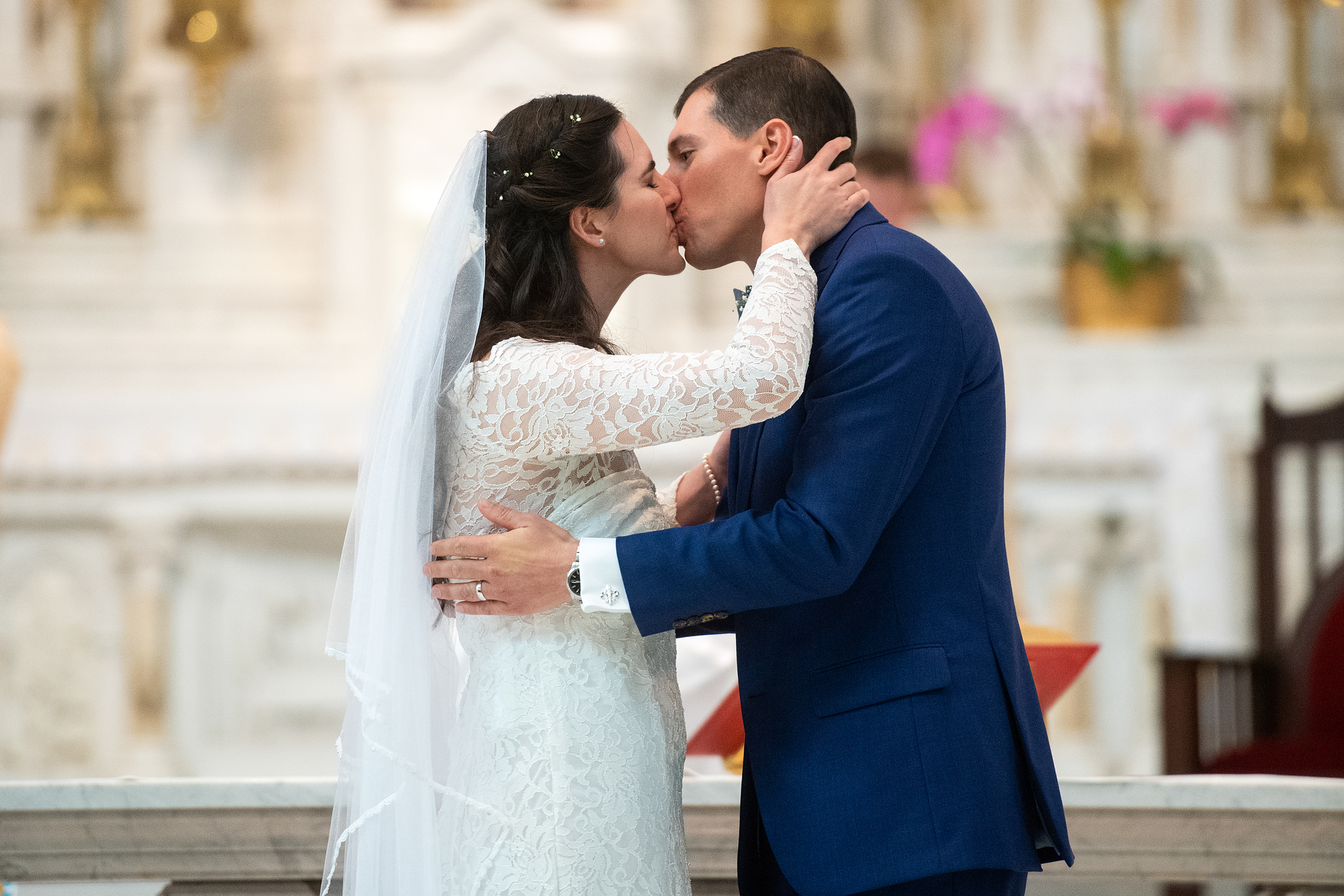 Bride and groom kiss during their Cathedral Basilica of the Immaculate Conception wedding in Denver, Colorado.