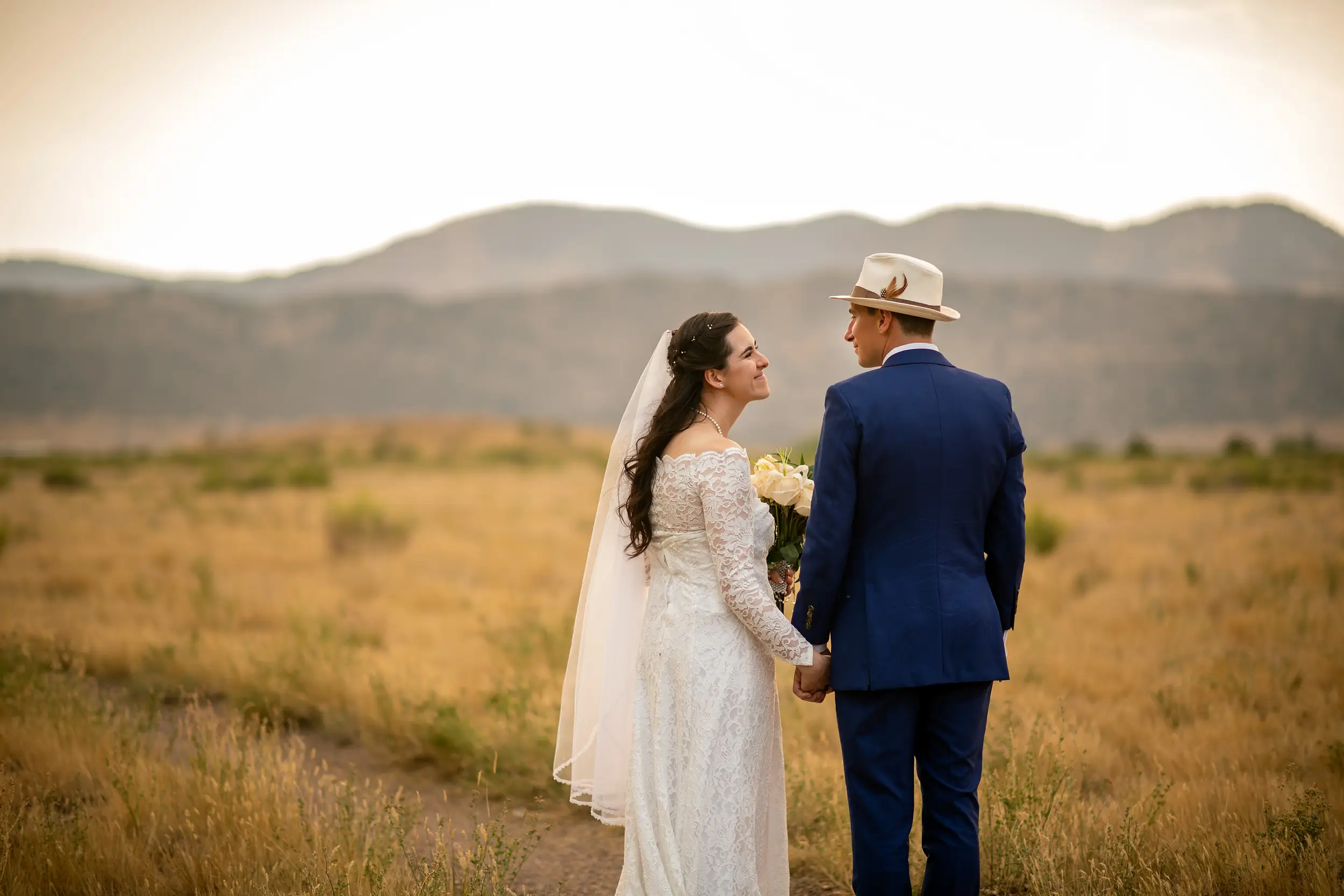 Bride and groom pose during their wedding portrait session at Bear Creek Lake Park in Lakewood, Colorado.