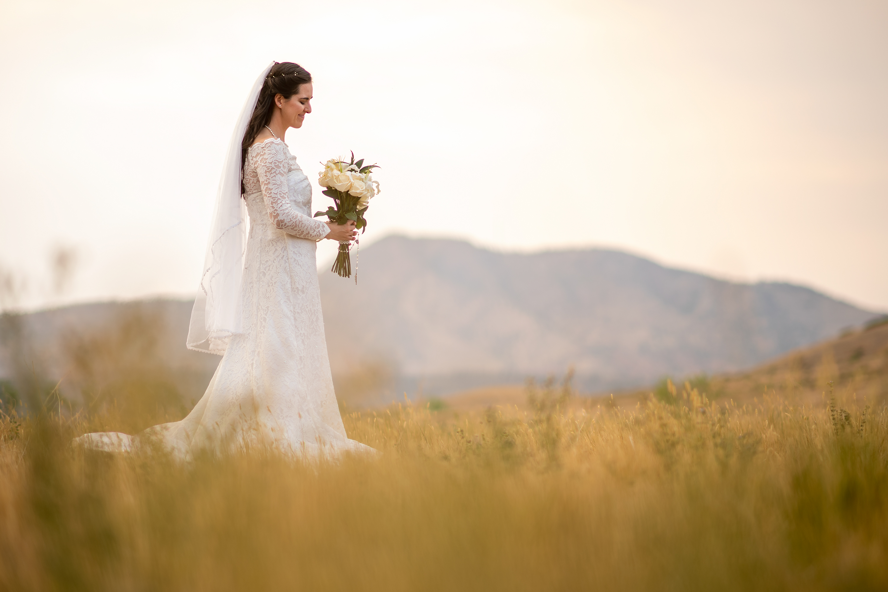 Bride poses during her wedding portrait session at Bear Creek Lake Park in Lakewood, Colorado.