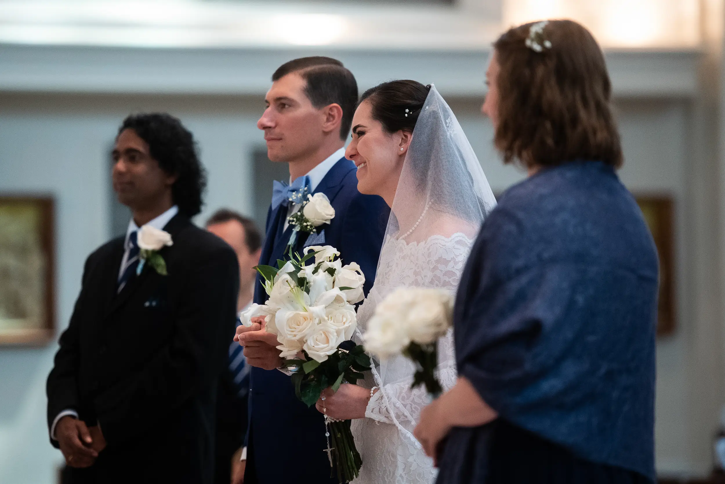 Bride and groom stand during their wedding at the Cathedral Basilica of the Immaculate Conception in Denver, Colorado.