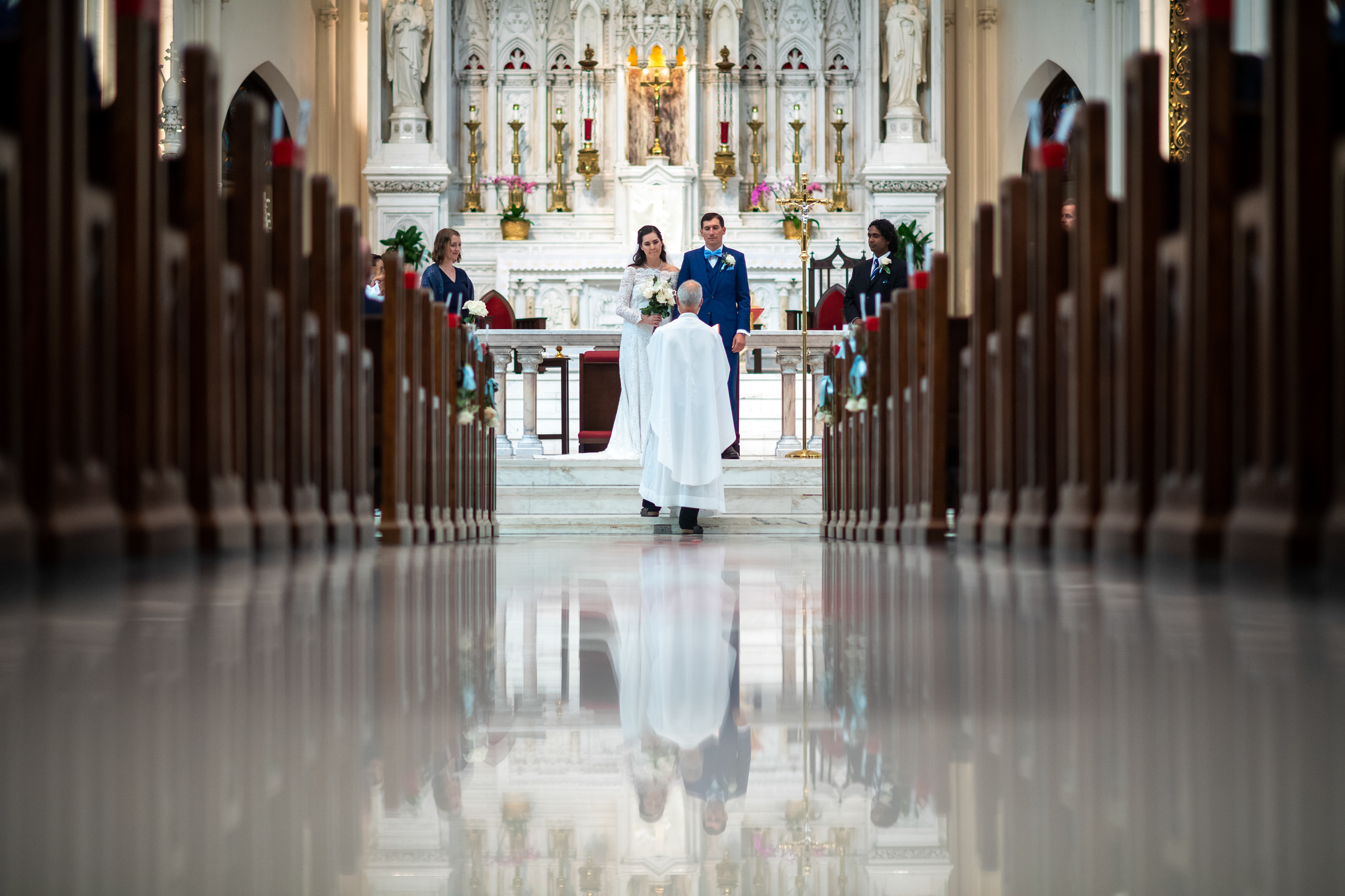 Bride and groom during their wedding at the Cathedral Basilica of the Immaculate Conception in Denver, Colorado.