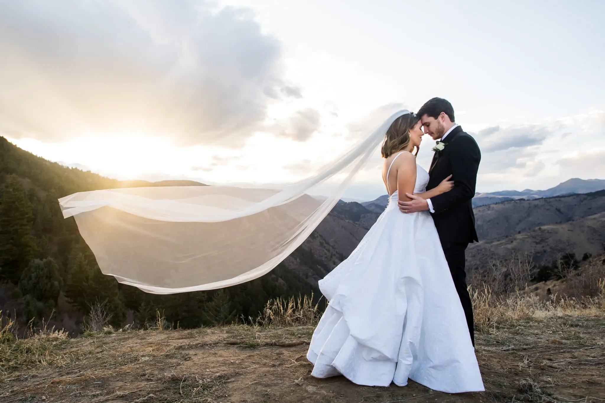 Bride and groom pose for Lookout Mountain Colorado wedding photos.
