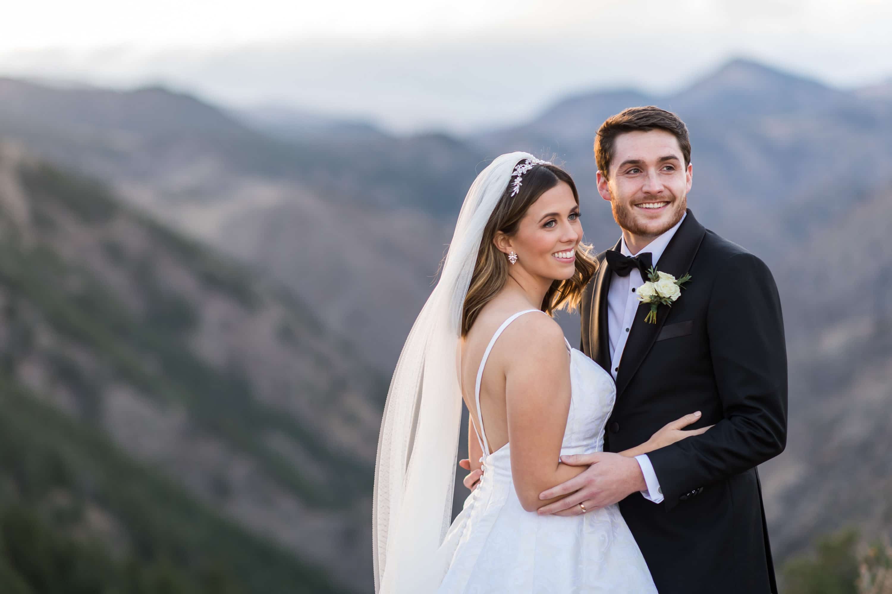 Bride and groom pose for Lookout Mountain Colorado wedding photos.