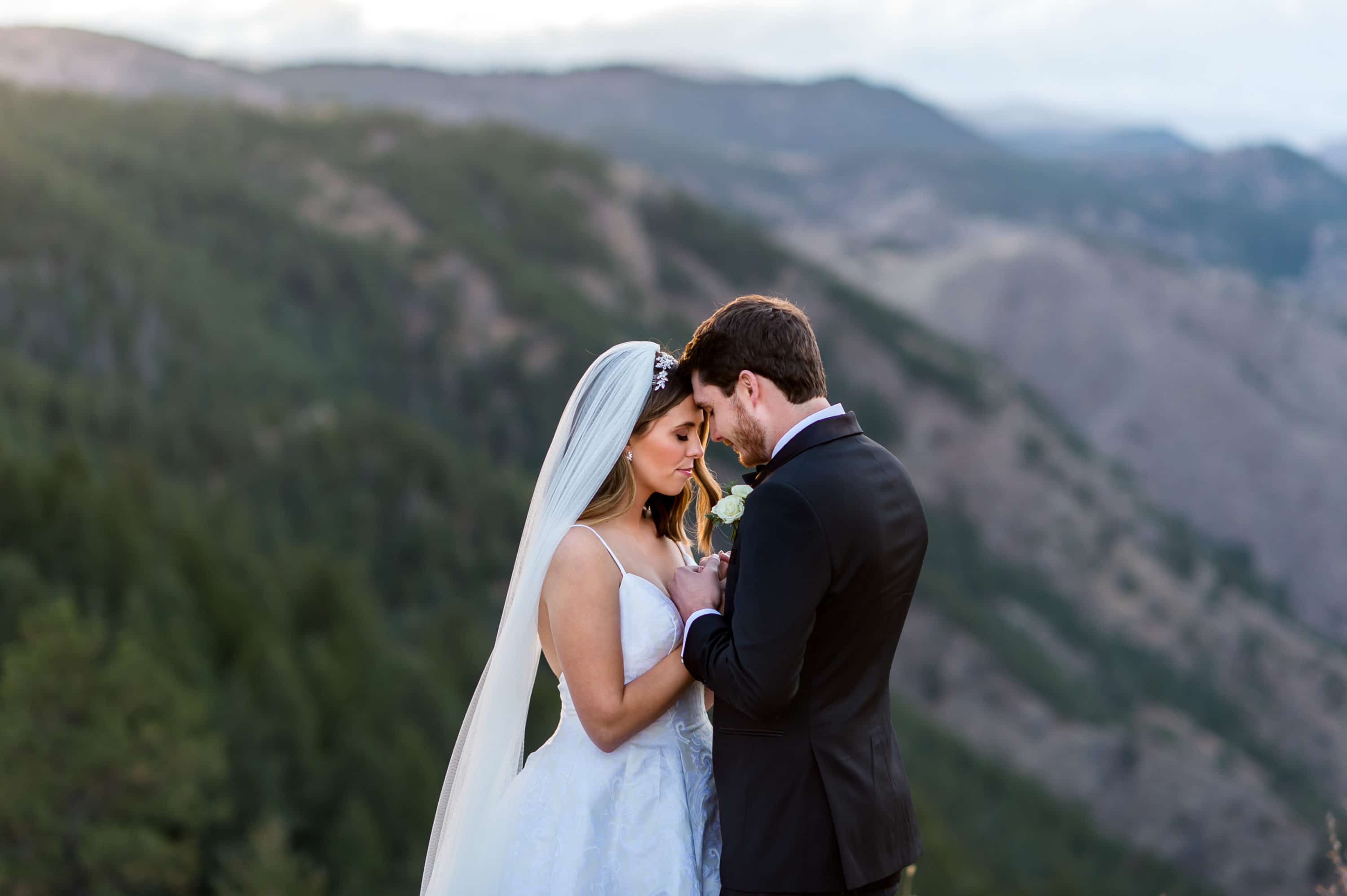 Bride and groom pose for Lookout Mountain Colorado wedding photos.