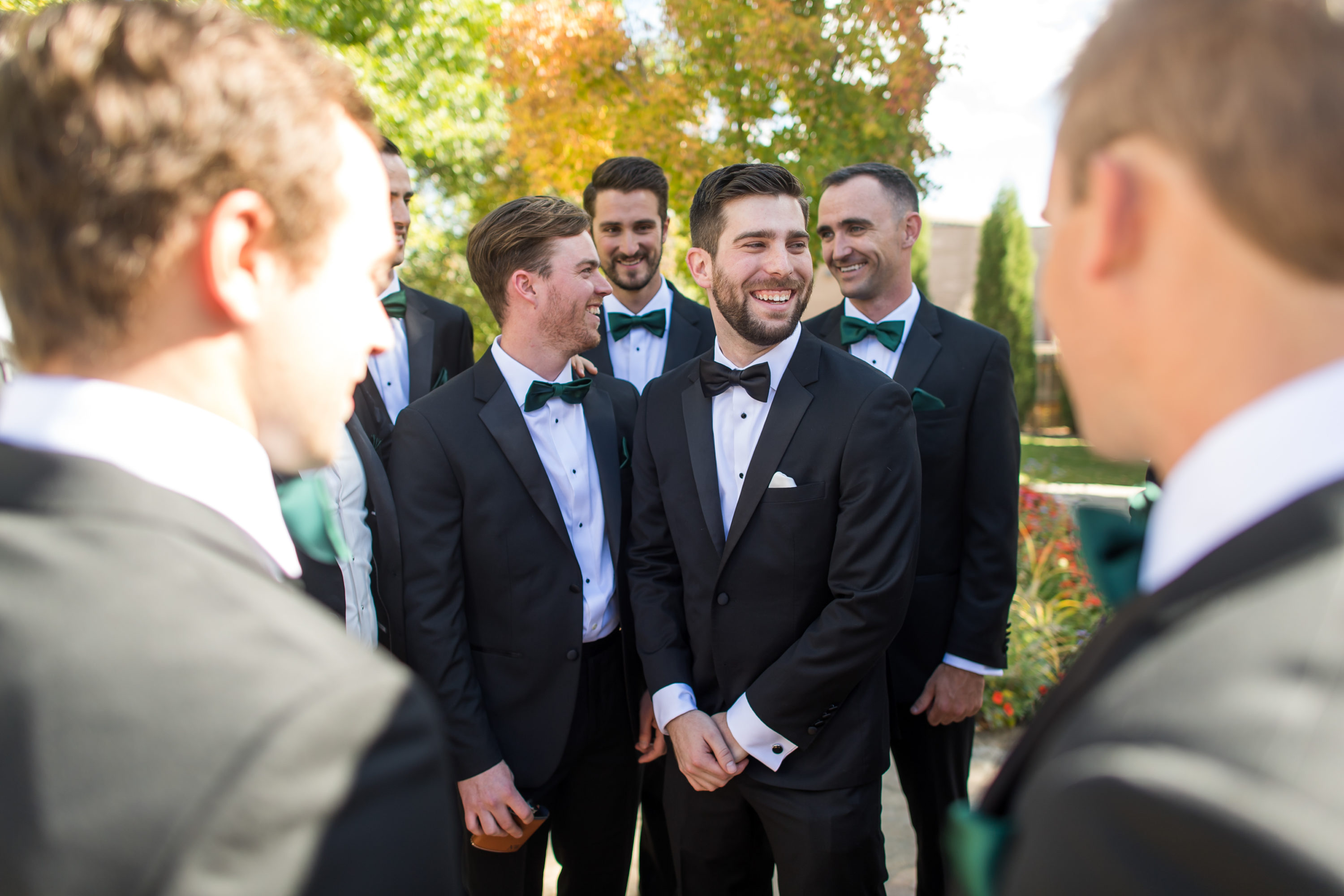 Groom spends time with groomsmen during at Baldoria on the Water wedding in Lakewood, Colorado.
