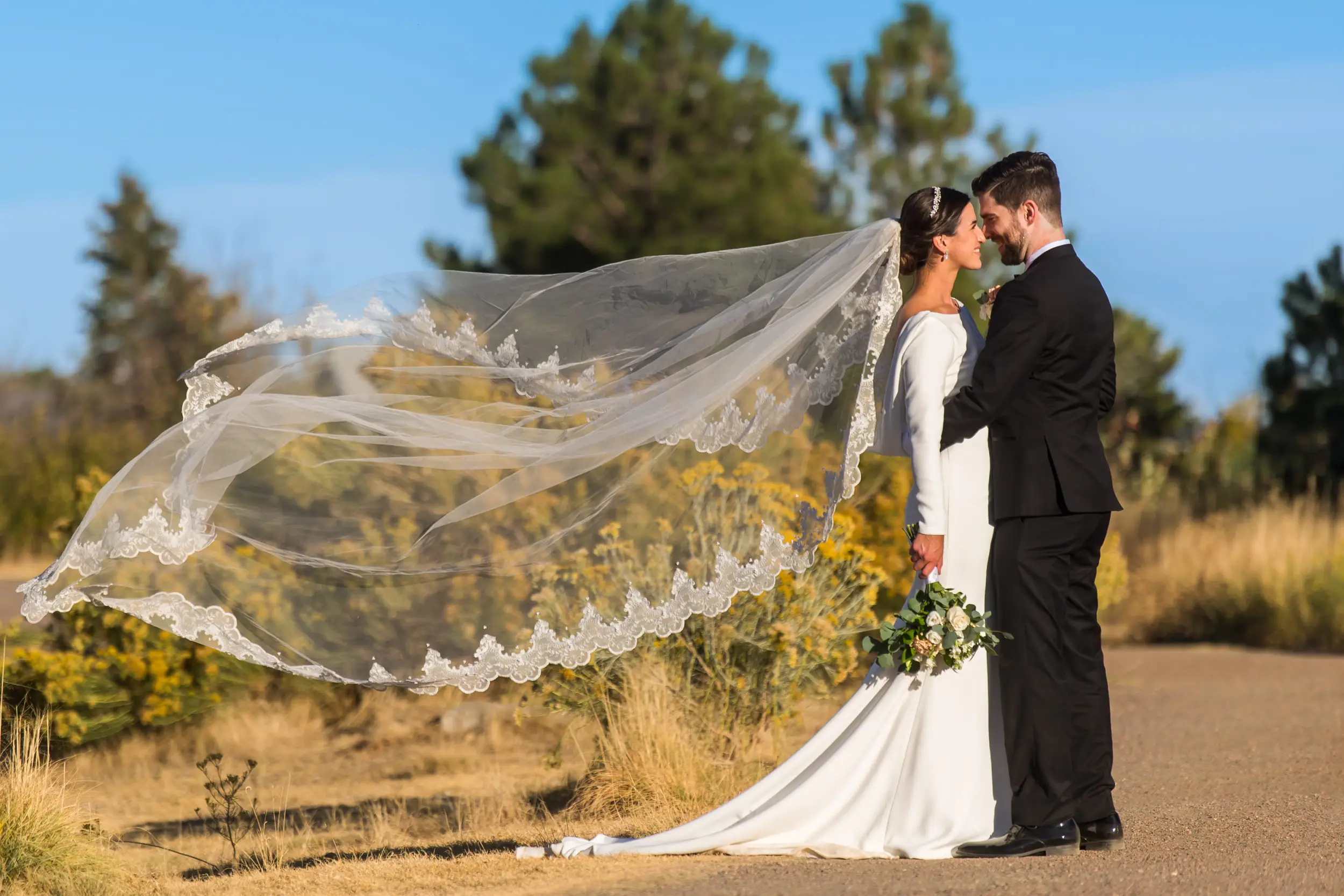 Bride and groom pose during wedding photo portraits at Belmar Park in Lakewood, Colorado.