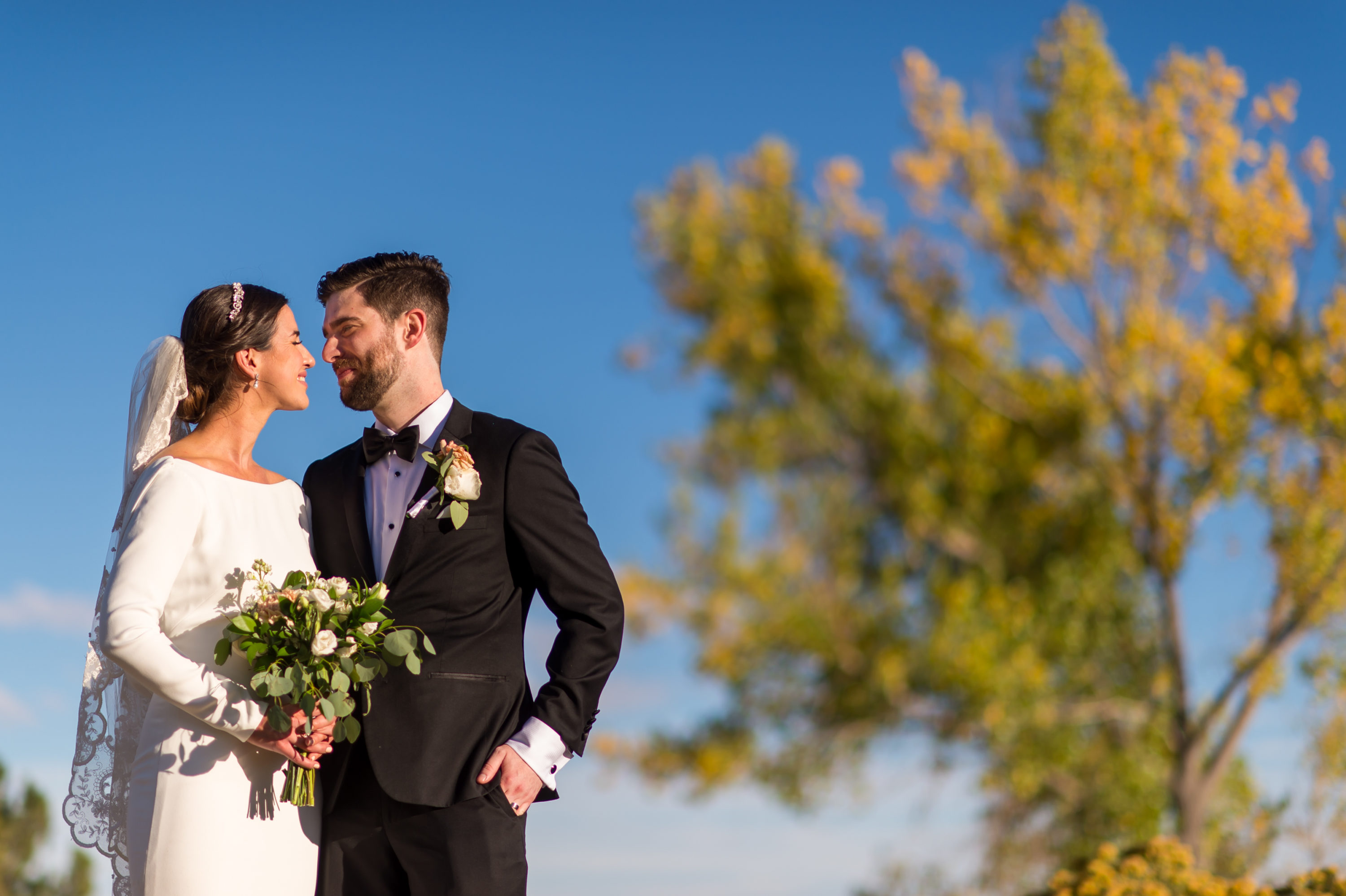 Bride and groom pose during wedding photo portraits at Belmar Park in Lakewood, Colorado.