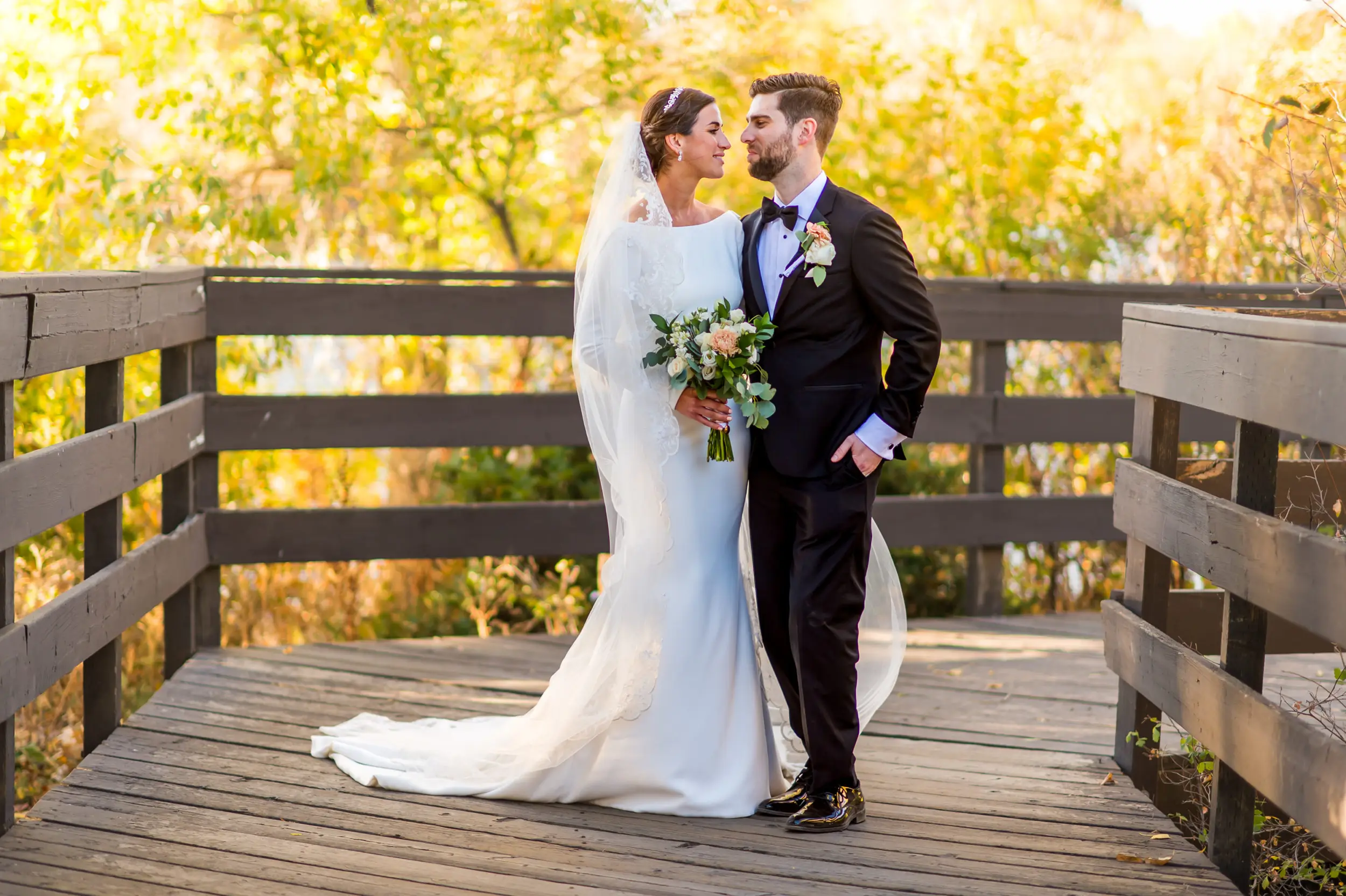 Bride and groom pose during wedding photo portraits at Belmar Park in Lakewood, Colorado.