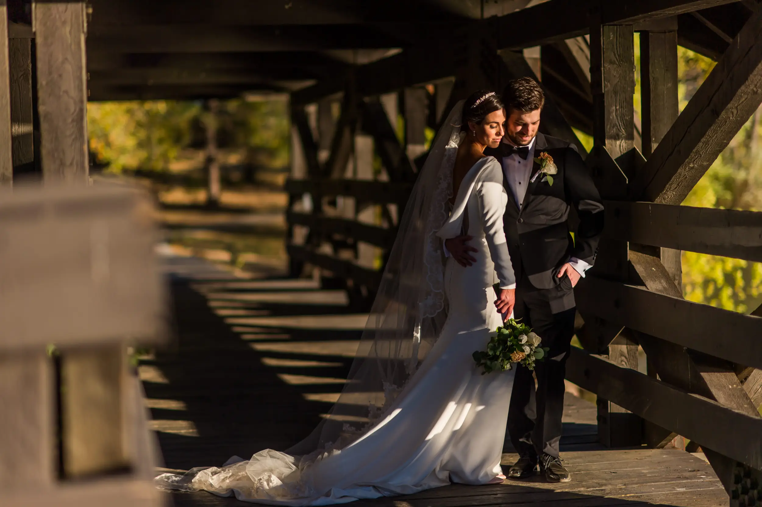 Bride and groom pose during wedding photo portraits at Belmar Park in Lakewood, Colorado.