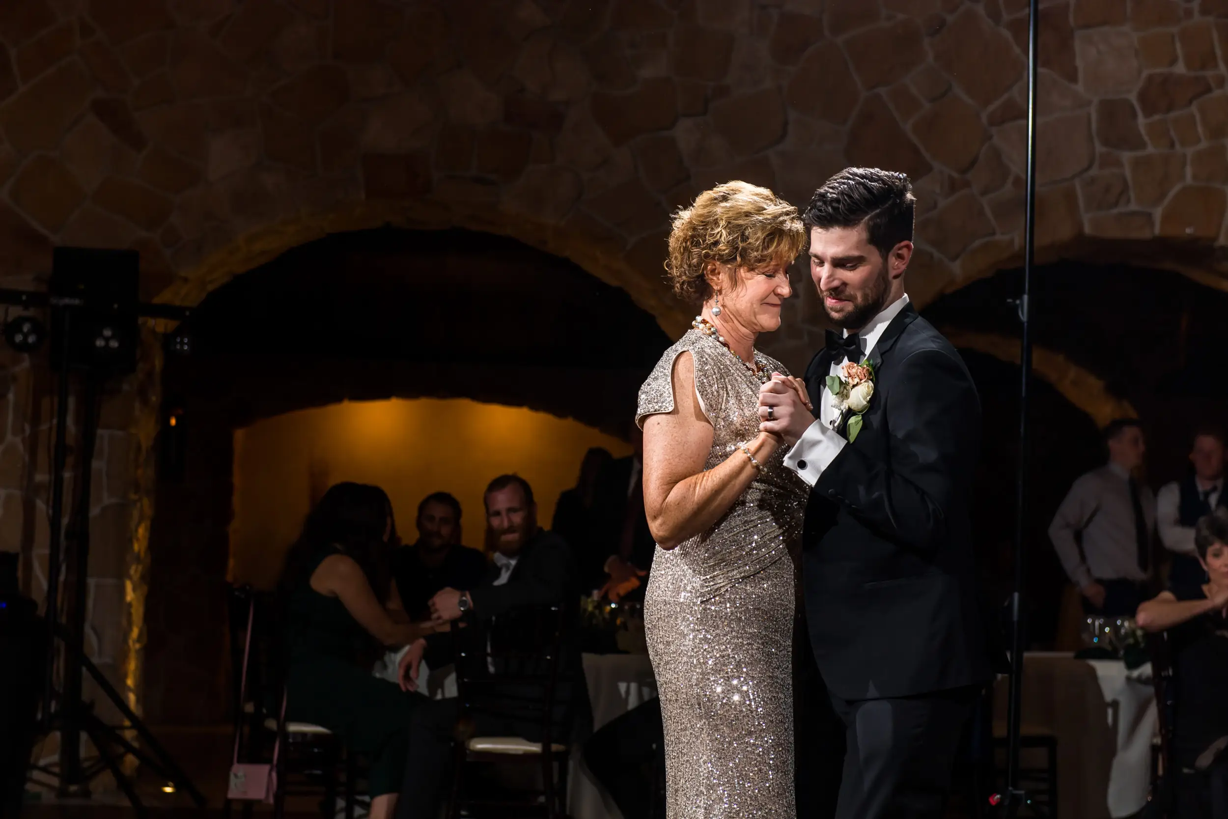 Groom and stepmom dance at Baldoria on the Water wedding venue in Lakewood, Colorado.