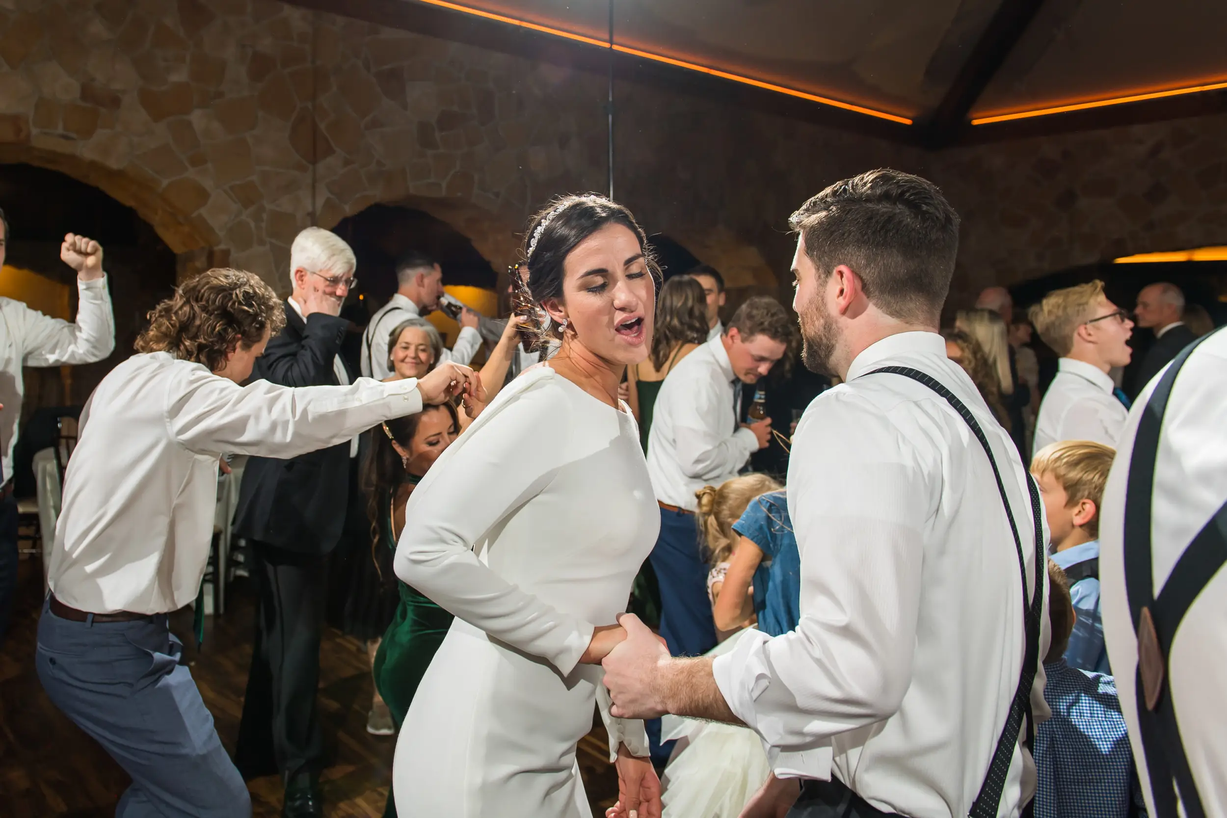 Bride and groom dance at Baldoria on the Water wedding venue in Lakewood, Colorado.