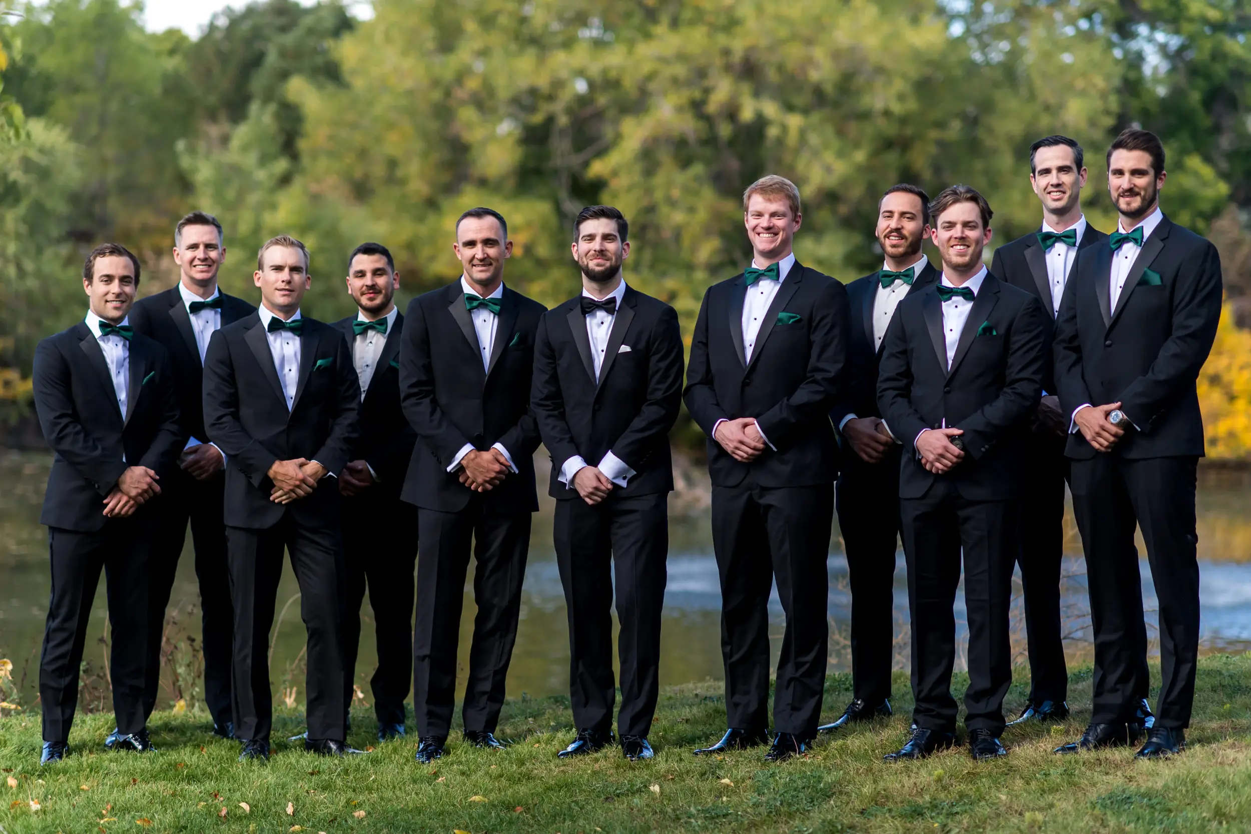Groom and groomsmen pose at Baldoria on the Water in Lakewood, Colorado.