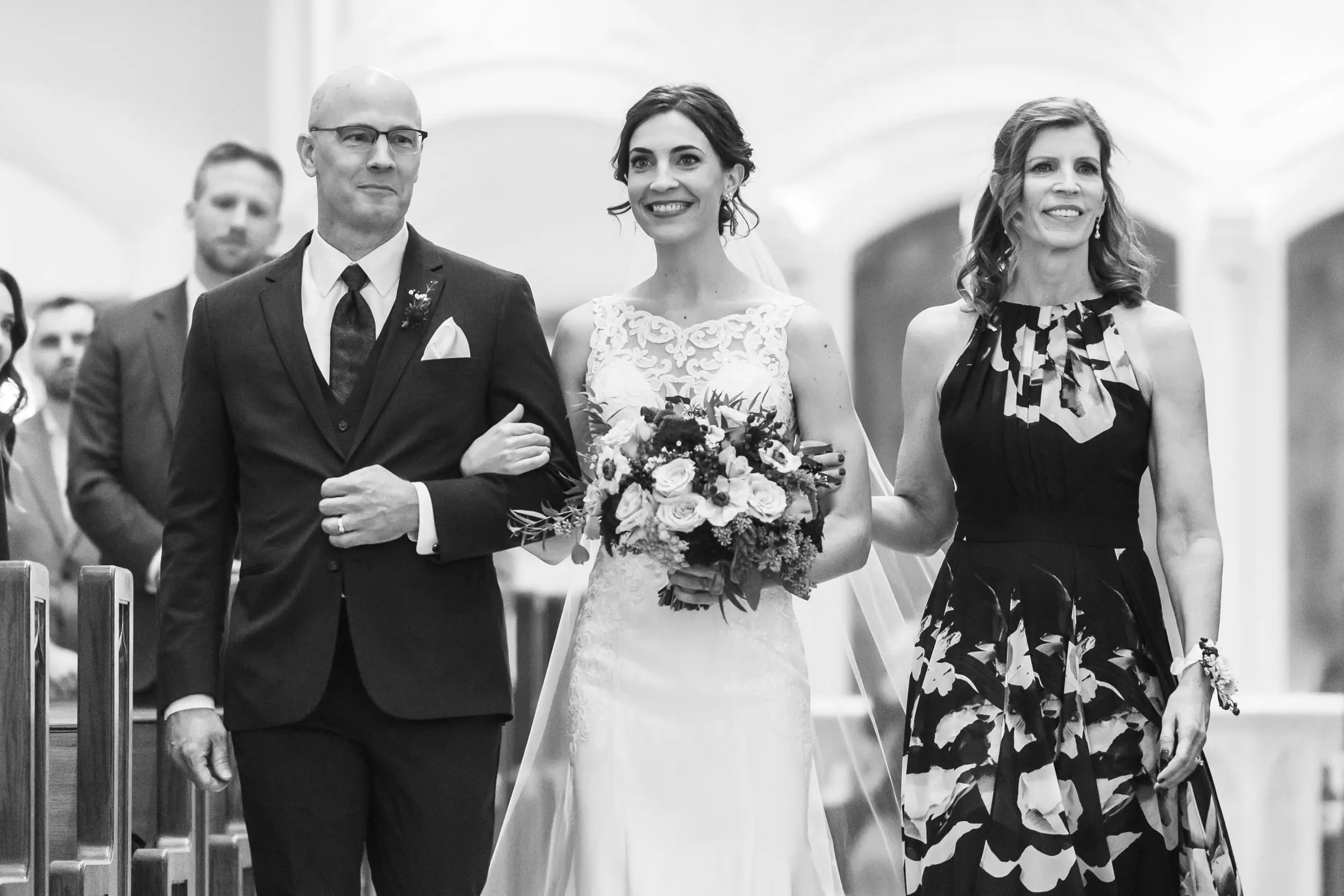 The bride processes in during her Cathedral Basilica of the Immaculate Conception wedding in Denver, Colorado.