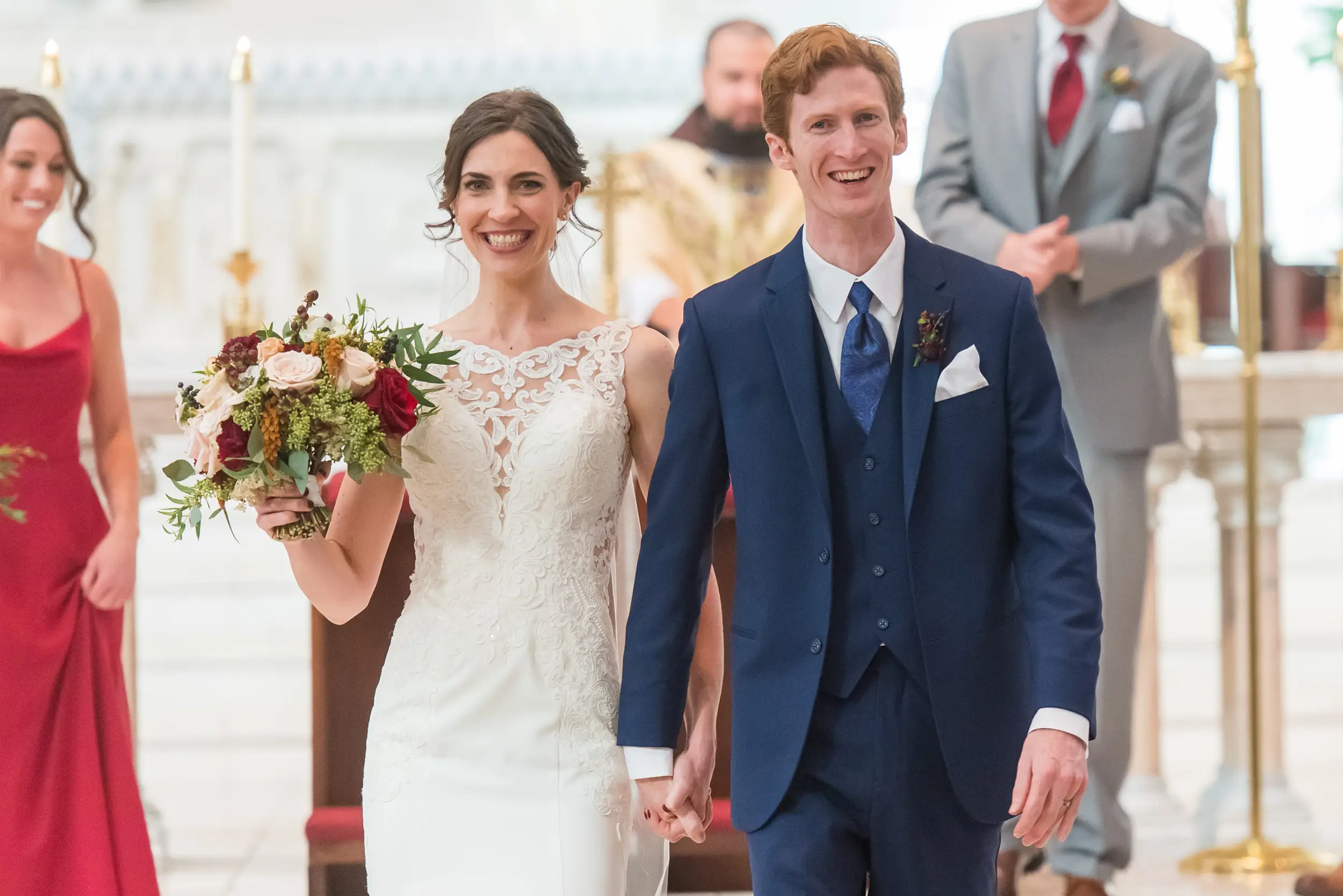 Bride and groom process out during a Cathedral Basilica of the Immaculate Conception wedding in Denver, Colorado.