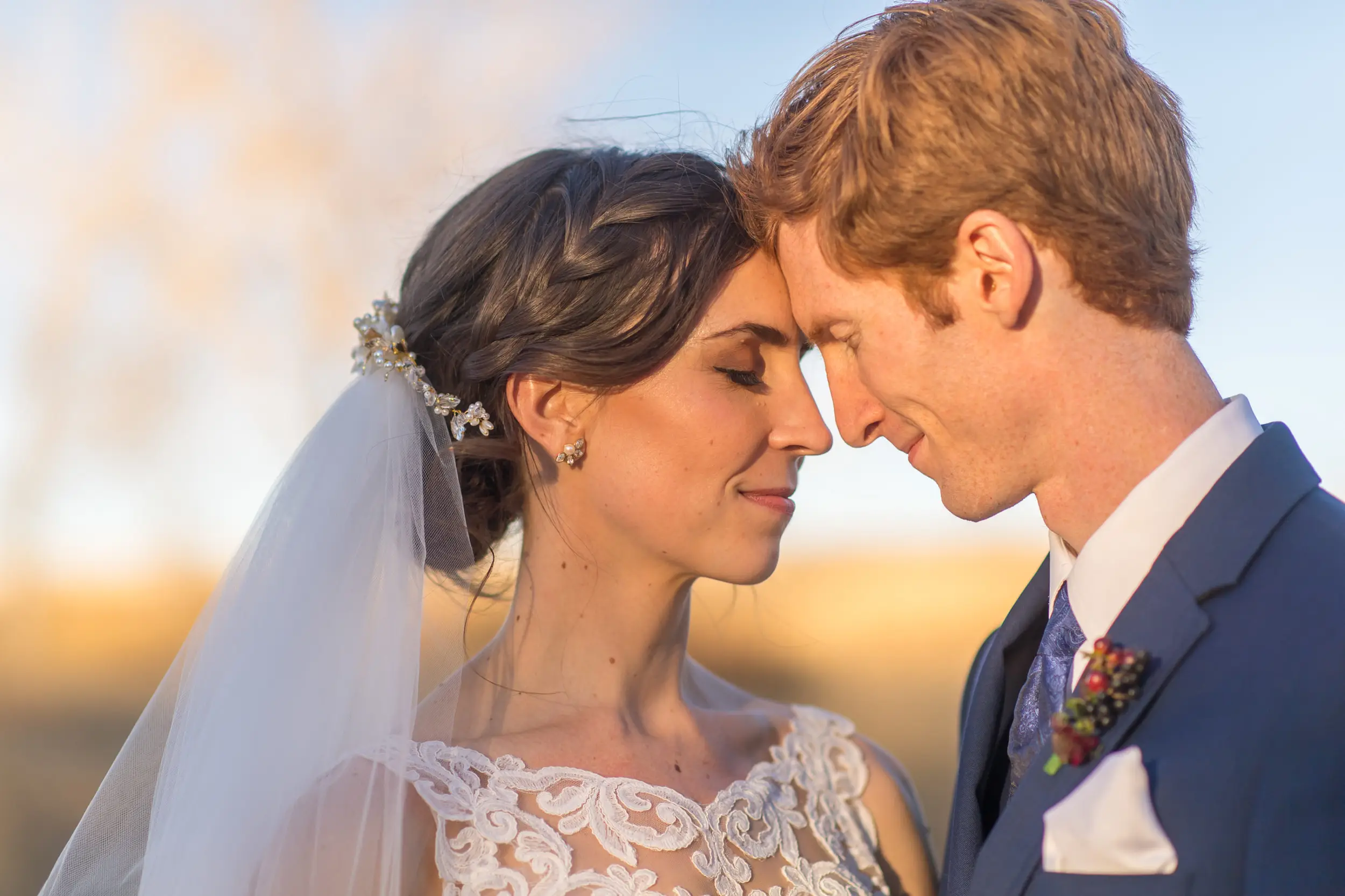 Bride and groom pose for photos at Cherry Creek State Park in Aurora, Colorado.