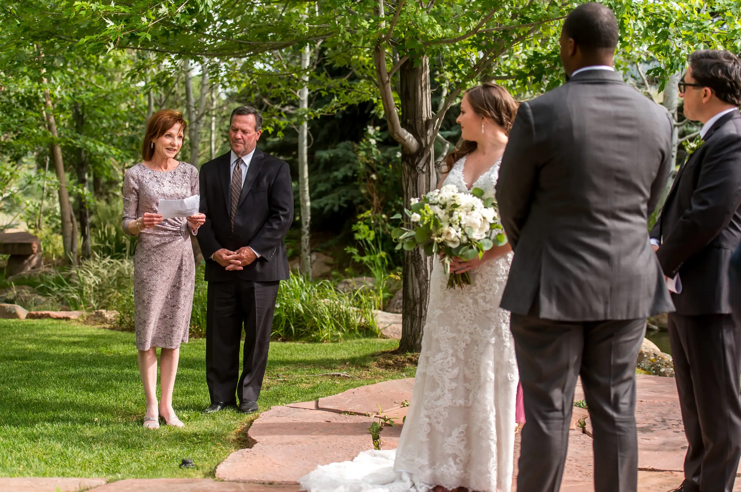 Parents of the bride read during a Greenbriar Inn wedding in Boulder, Colorado.
