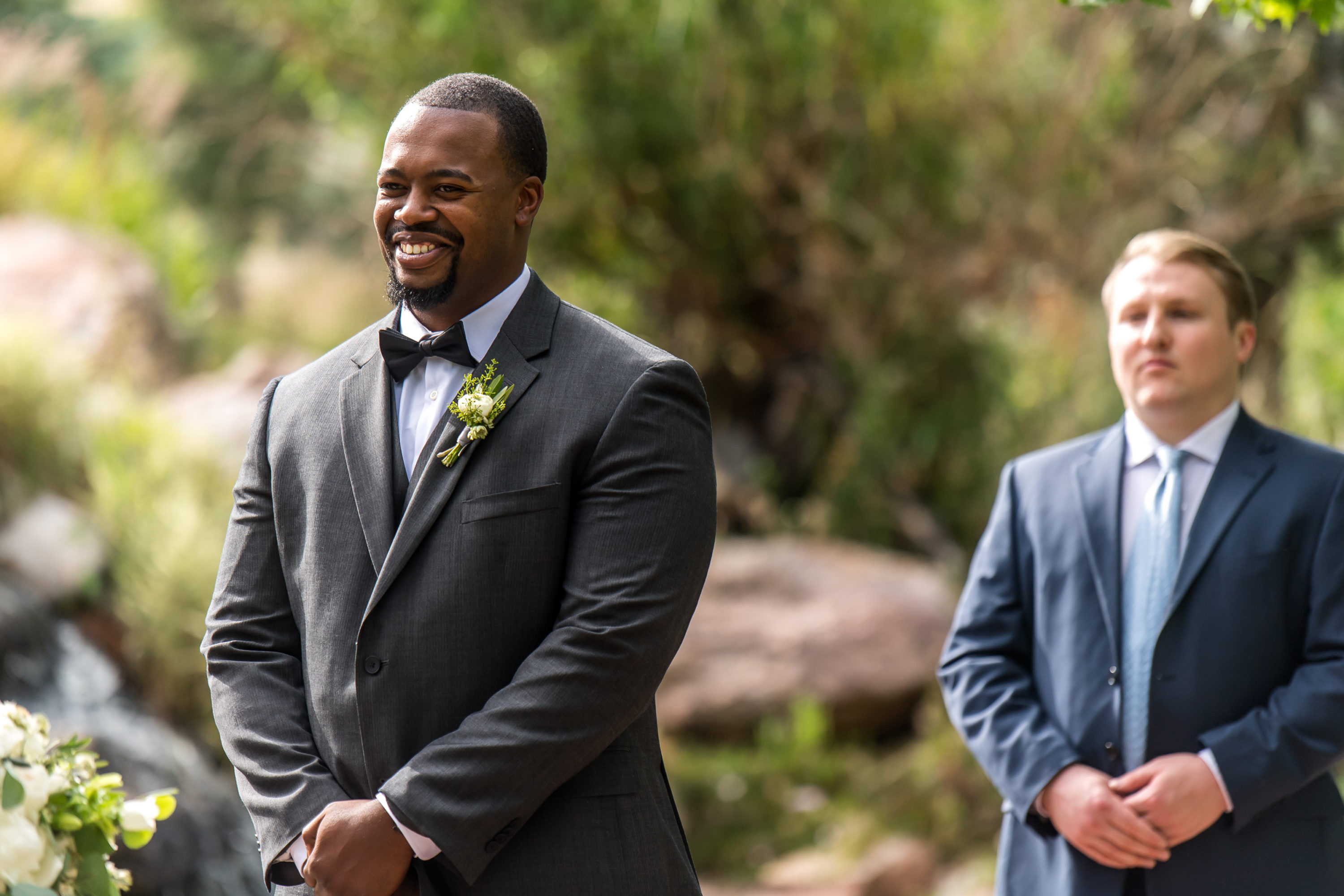 The groom smiles during a Greenbriar Inn wedding in Boulder, Colorado.