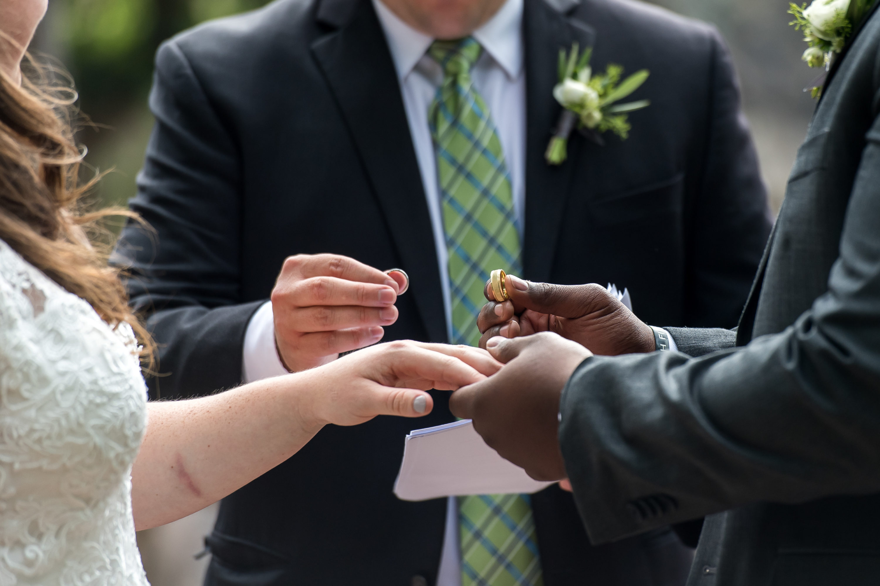 Handling of the rings during a Greenbriar Inn wedding in Boulder, Colorado.