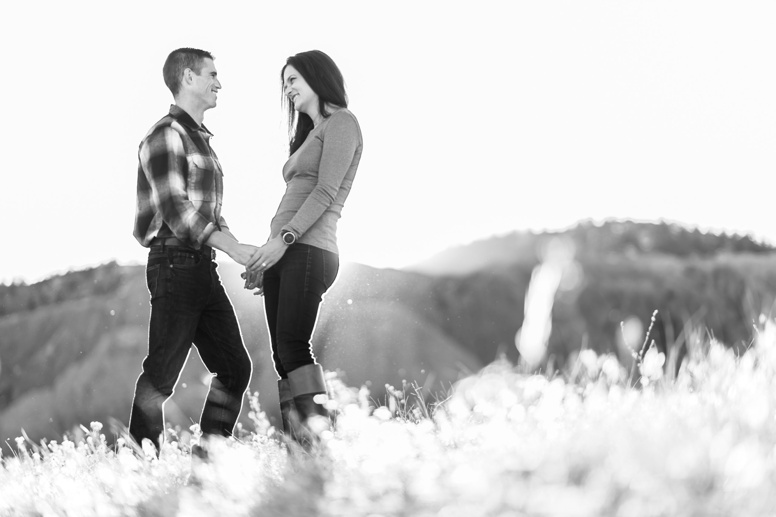Victoria and Justin embrace in Roxborough State Park Littleton for their engagement session.