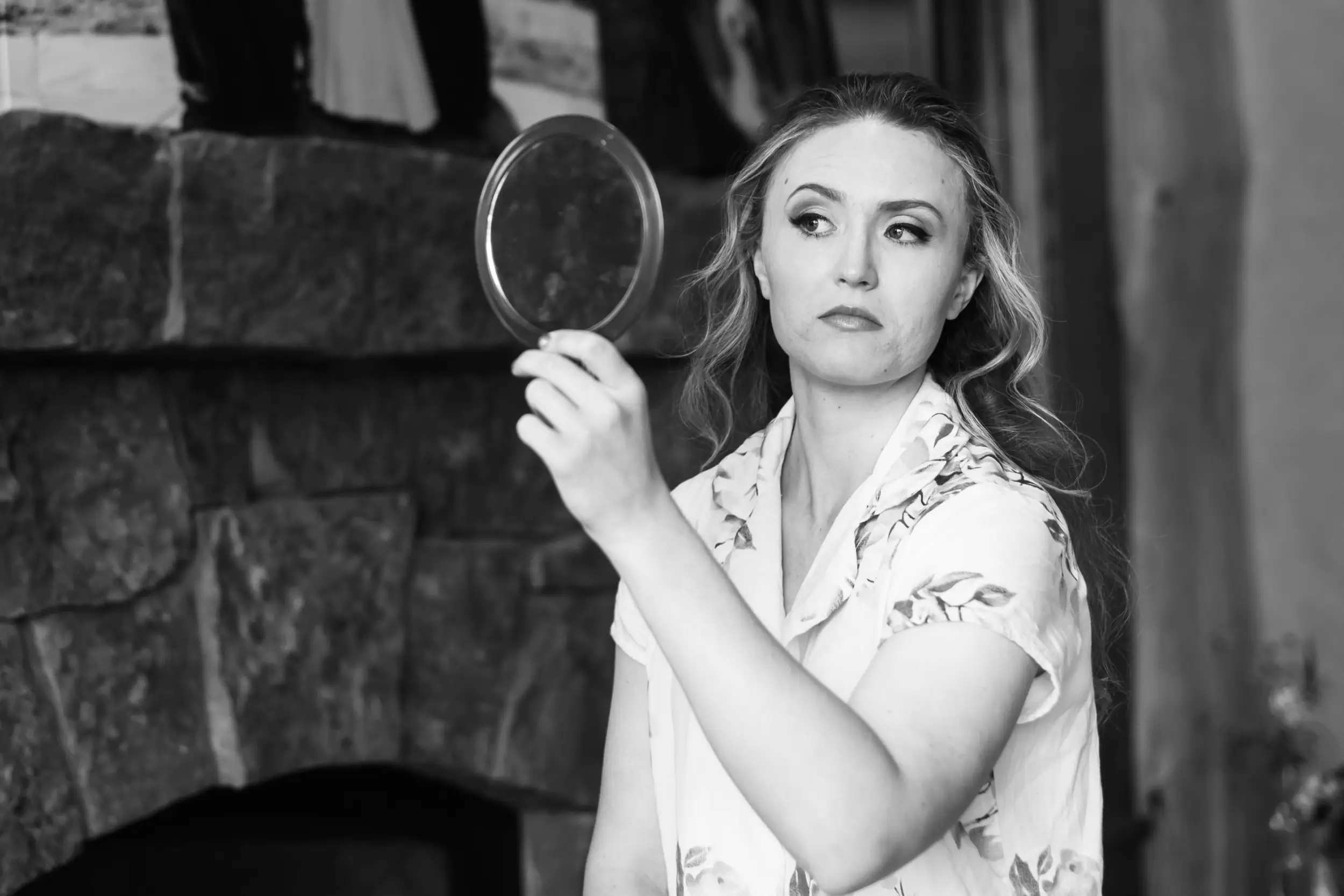 The bride looks in the mirror before her Telluride, Colorado, wedding.