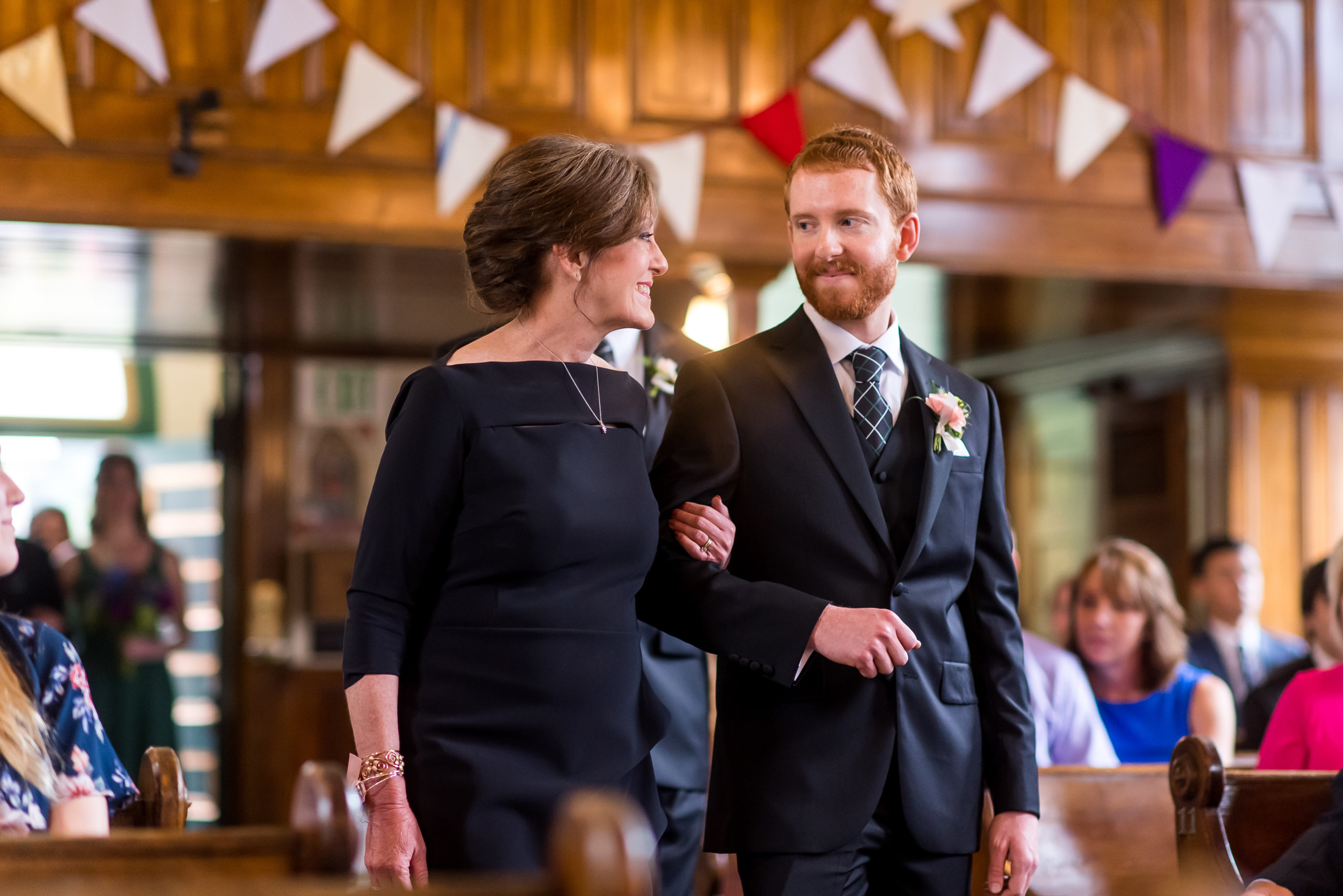 The groom and his mother process in to St. Patrick's Catholic Church in Telluride, Colorado.