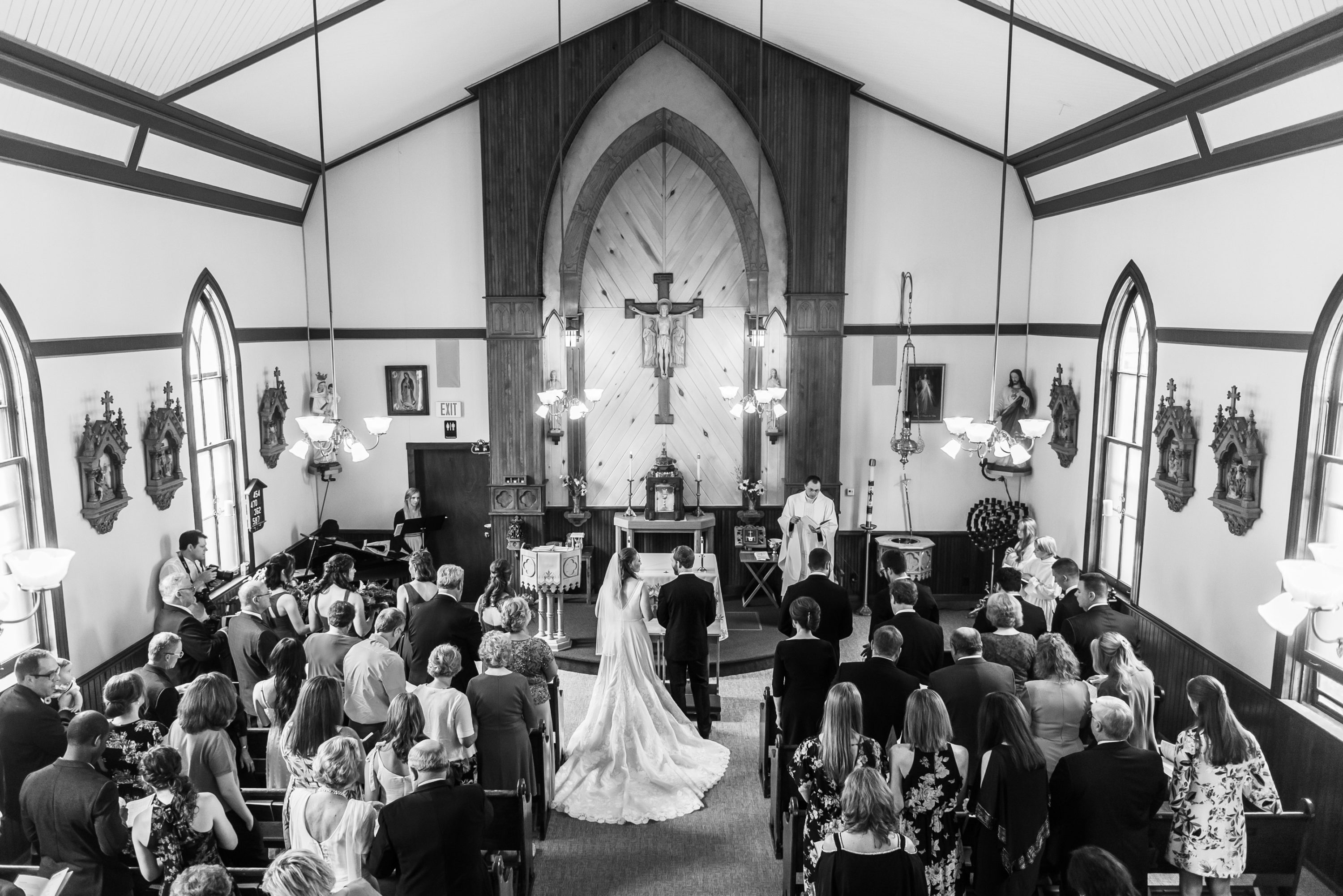 The bride and groom stand during their Telluride, Colorado, wedding at St. Patrick's Catholic Church.