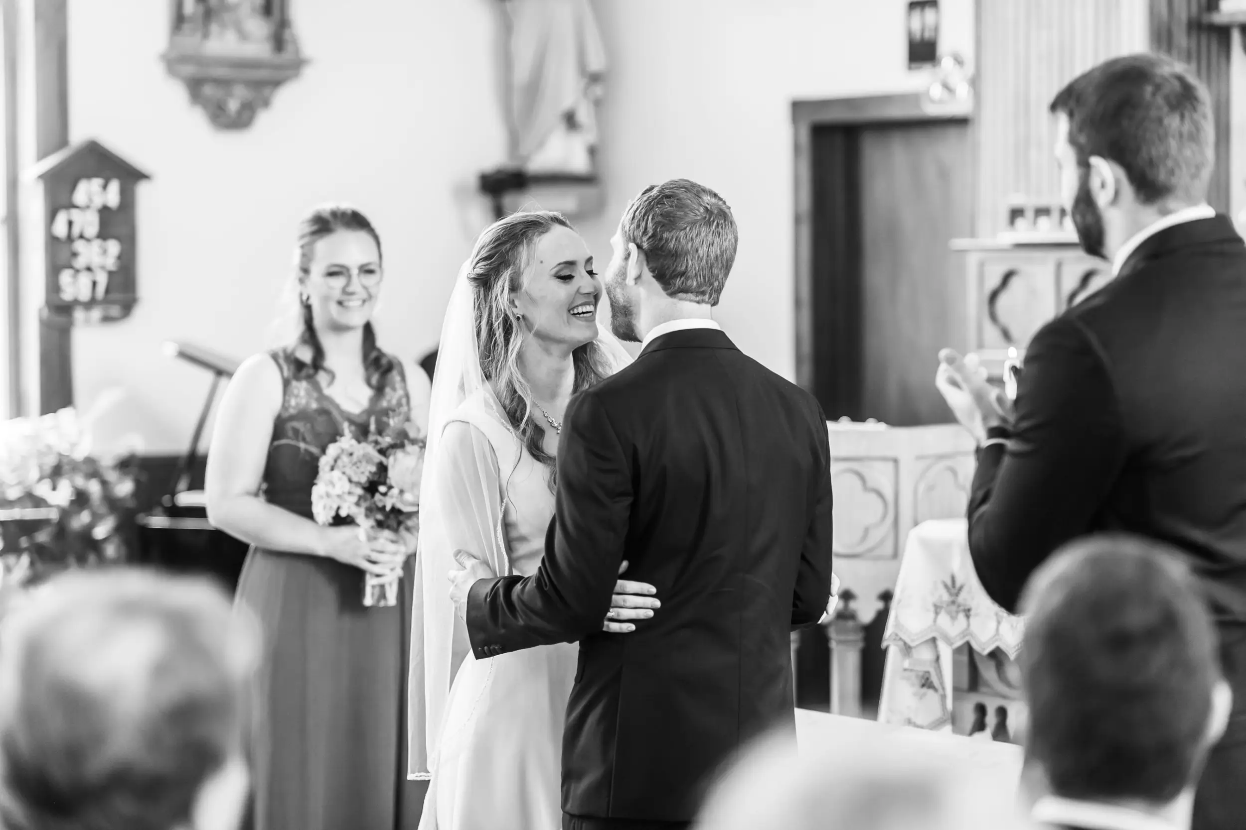 The bride and groom kiss during a Telluride, Colorado, wedding at St. Patrick's Catholic Church.