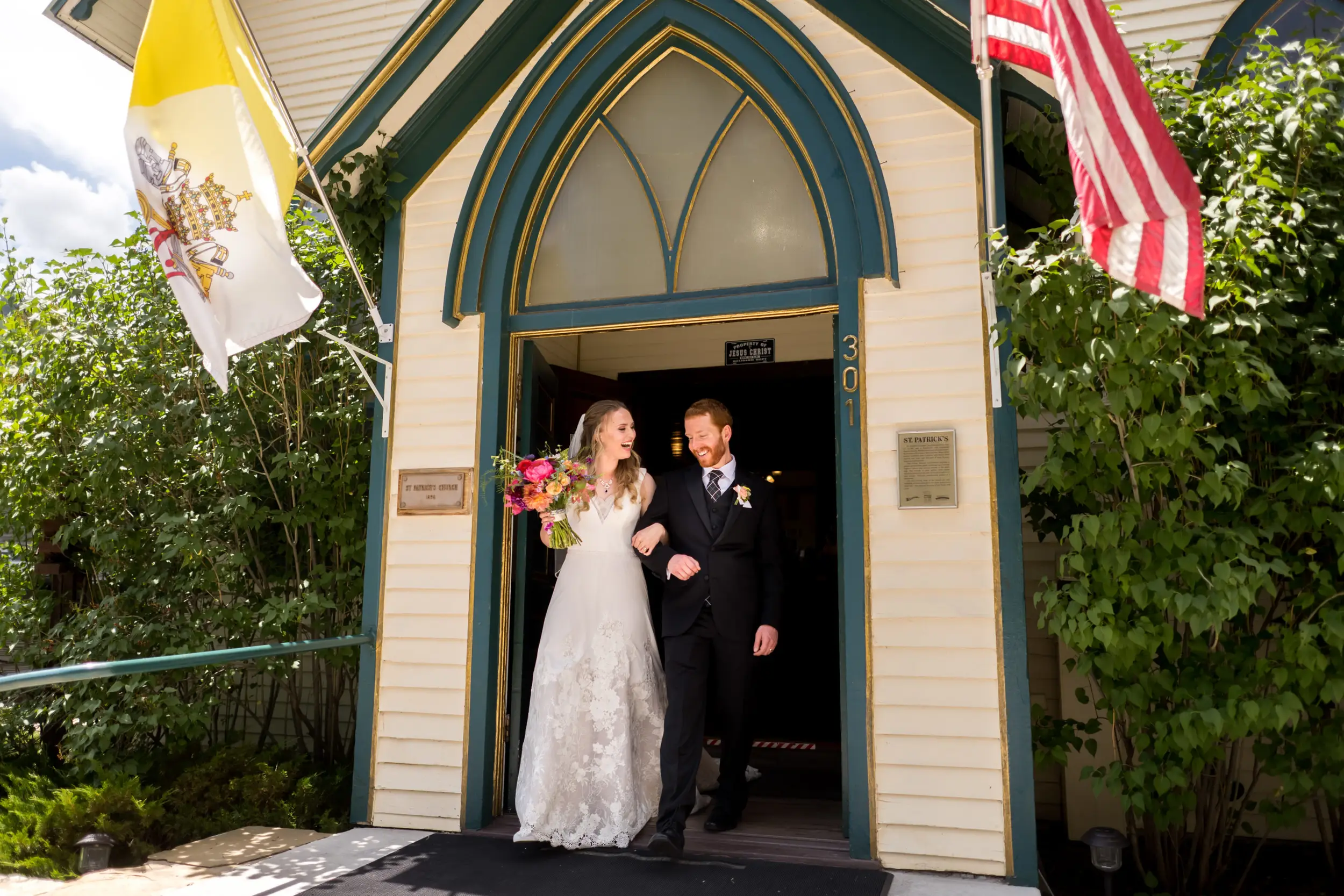 The bride and groom process out of the church after their wedding at St. Patrick's Church Telluride.