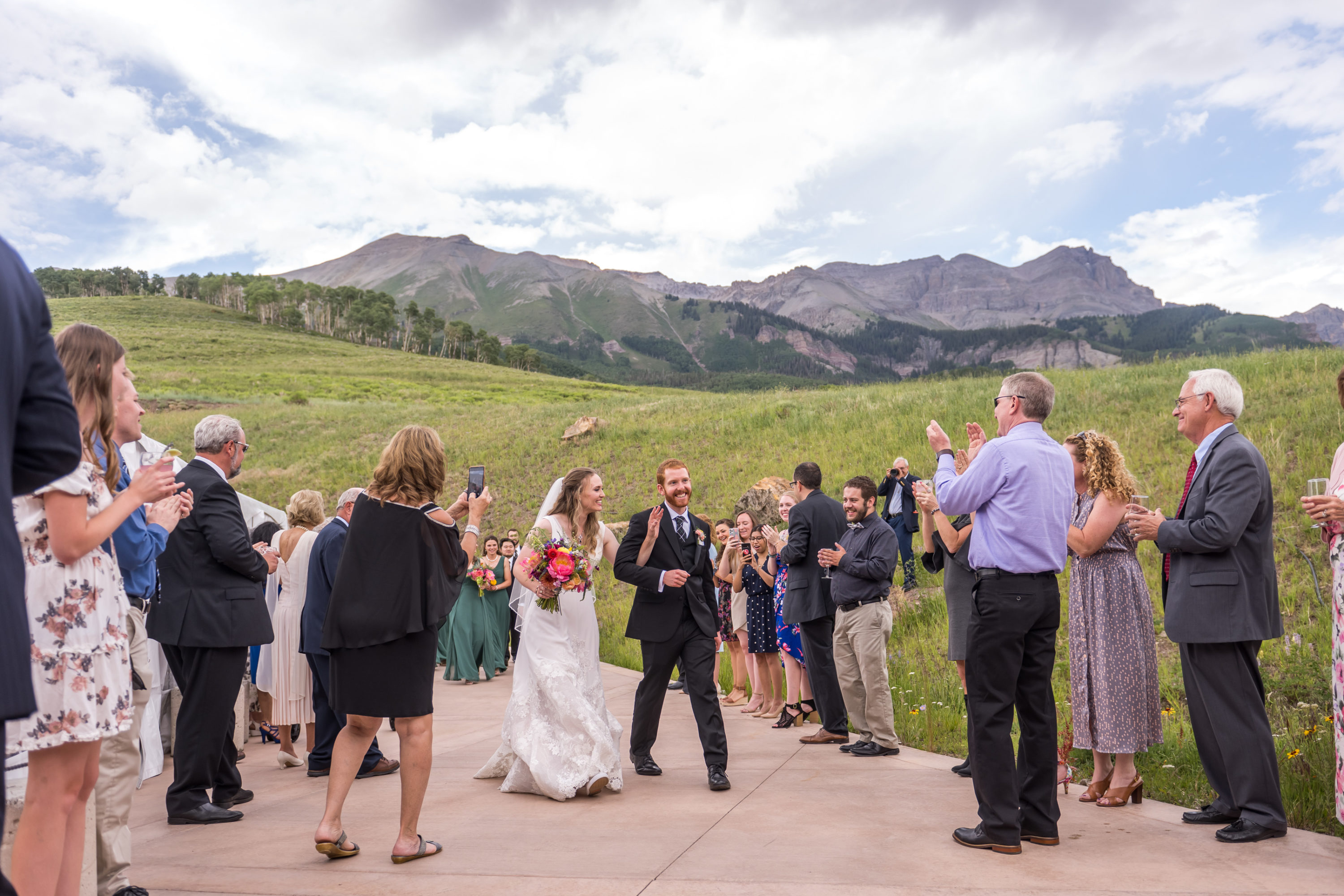 The bride and groom arrive during their wedding in Telluride, Colorado.