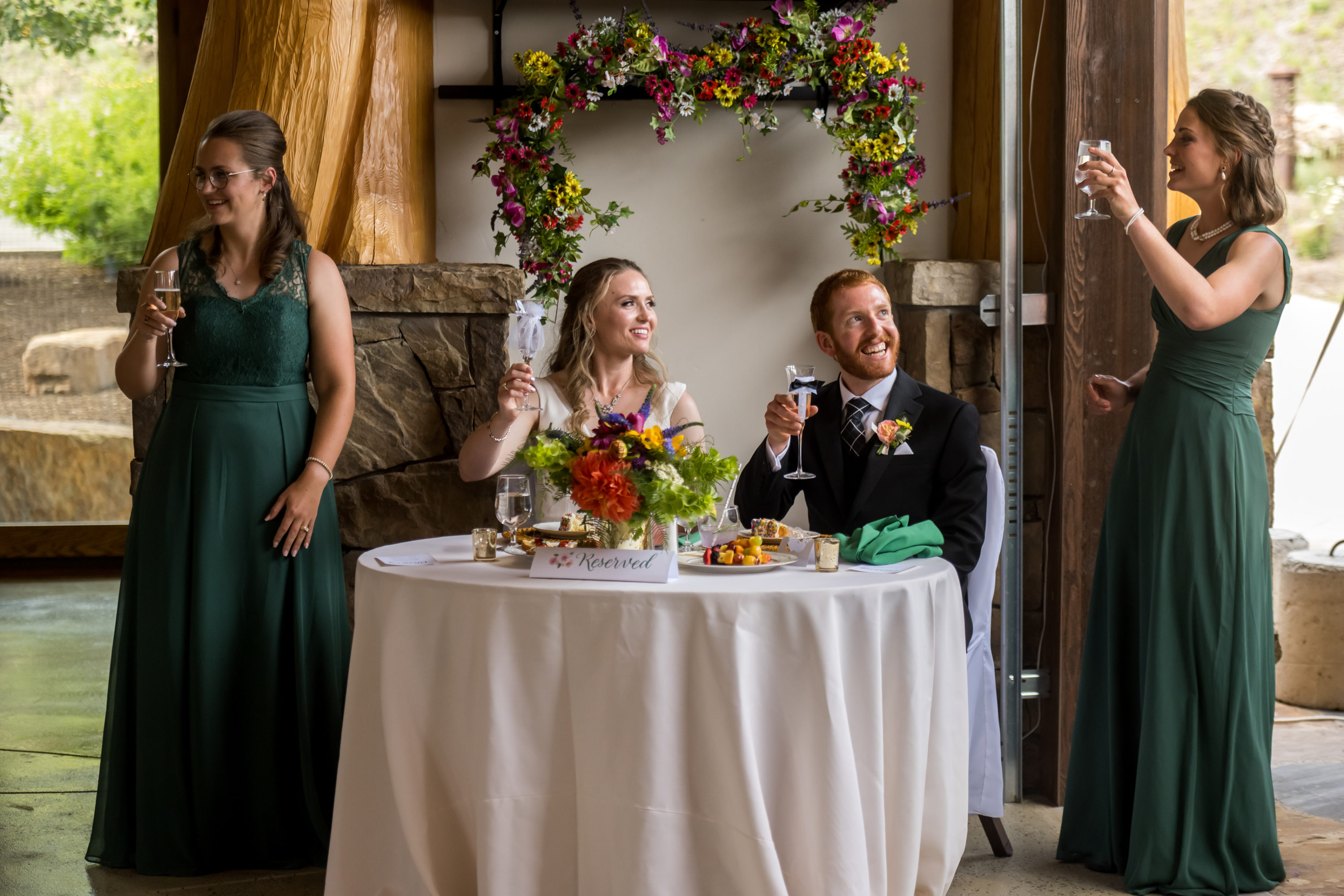 The co-maids of honor speak during a wedding in Telluride, Colorado.