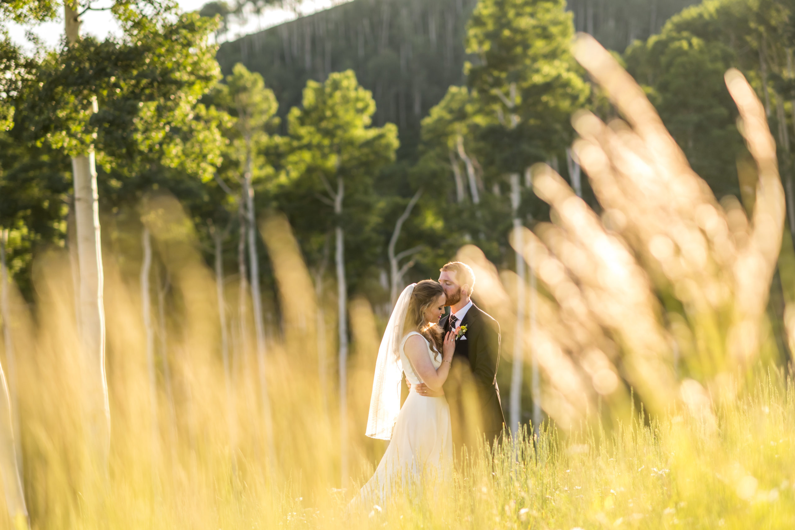 The bride and groom kiss during their Telluride, Colorado, wedding.