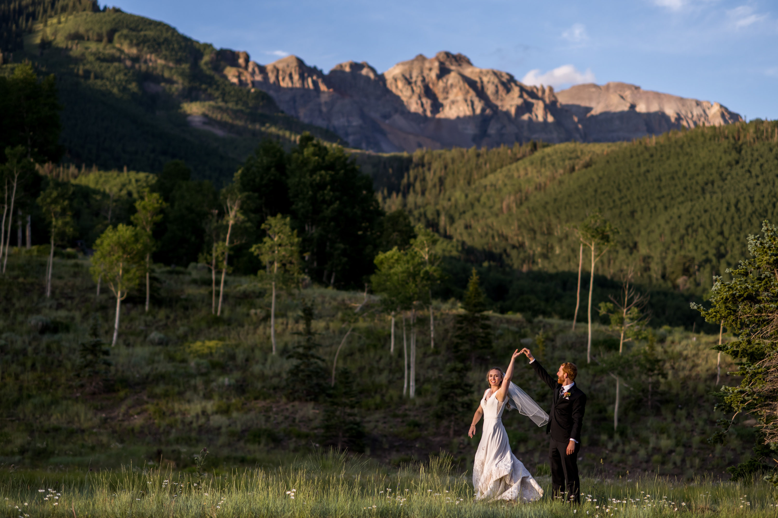 Bride and groom dance at sunset during Telluride, Colorado, wedding.