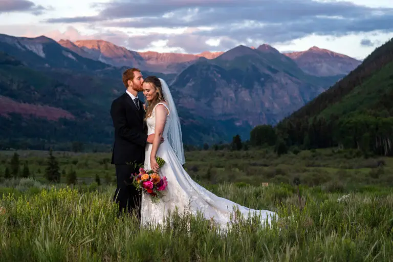Bride and groom pose at sunset during Telluride, Colorado, wedding.