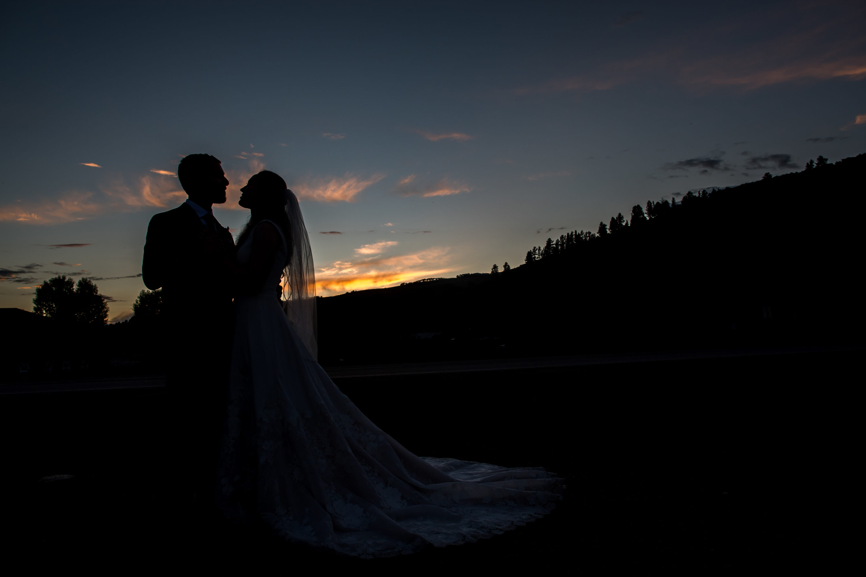 Bride and groom pose at sunset during Telluride, Colorado, wedding.