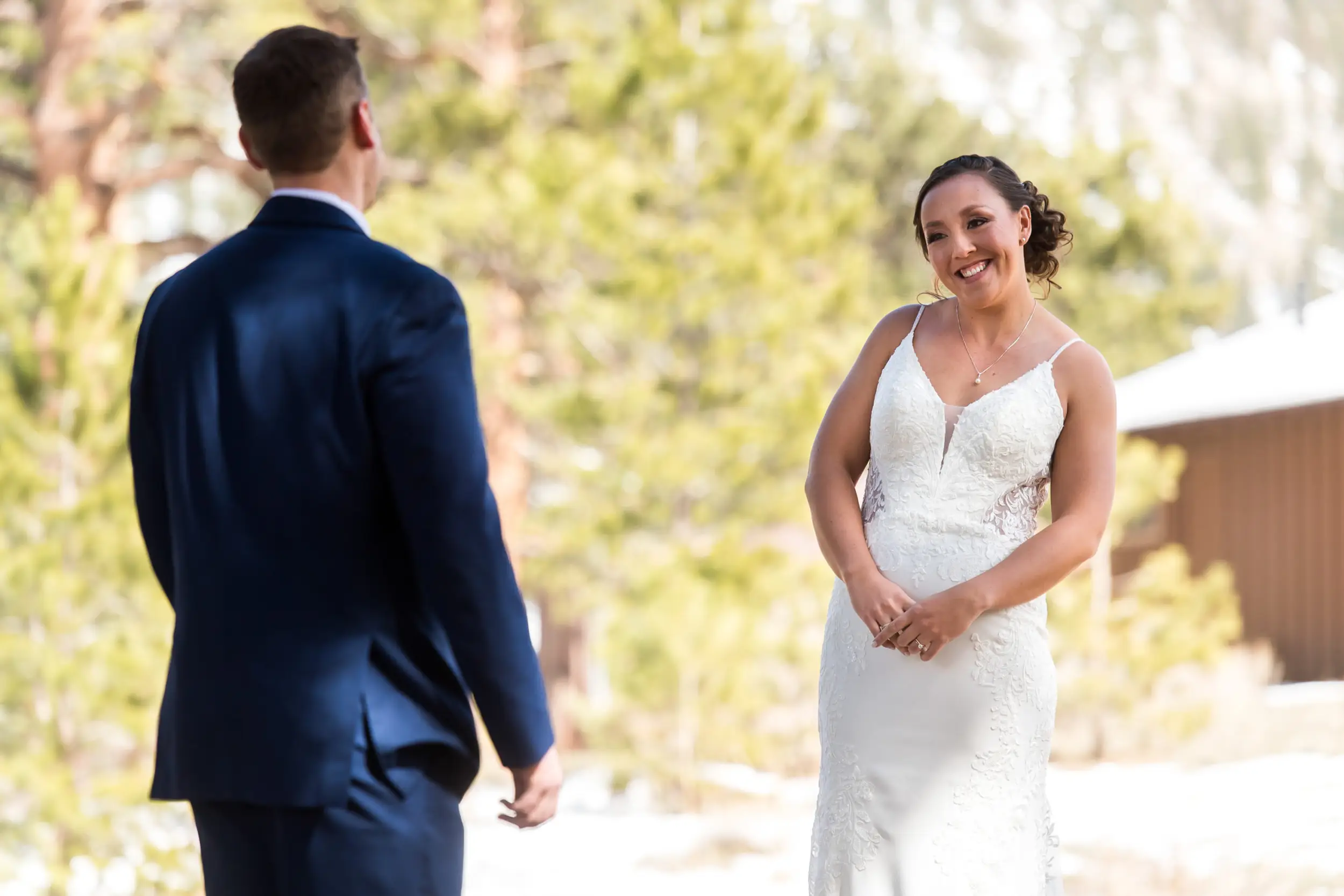 The bride and groom first look during their YMCA of the Rockies wedding in Estes Park, Colorado.