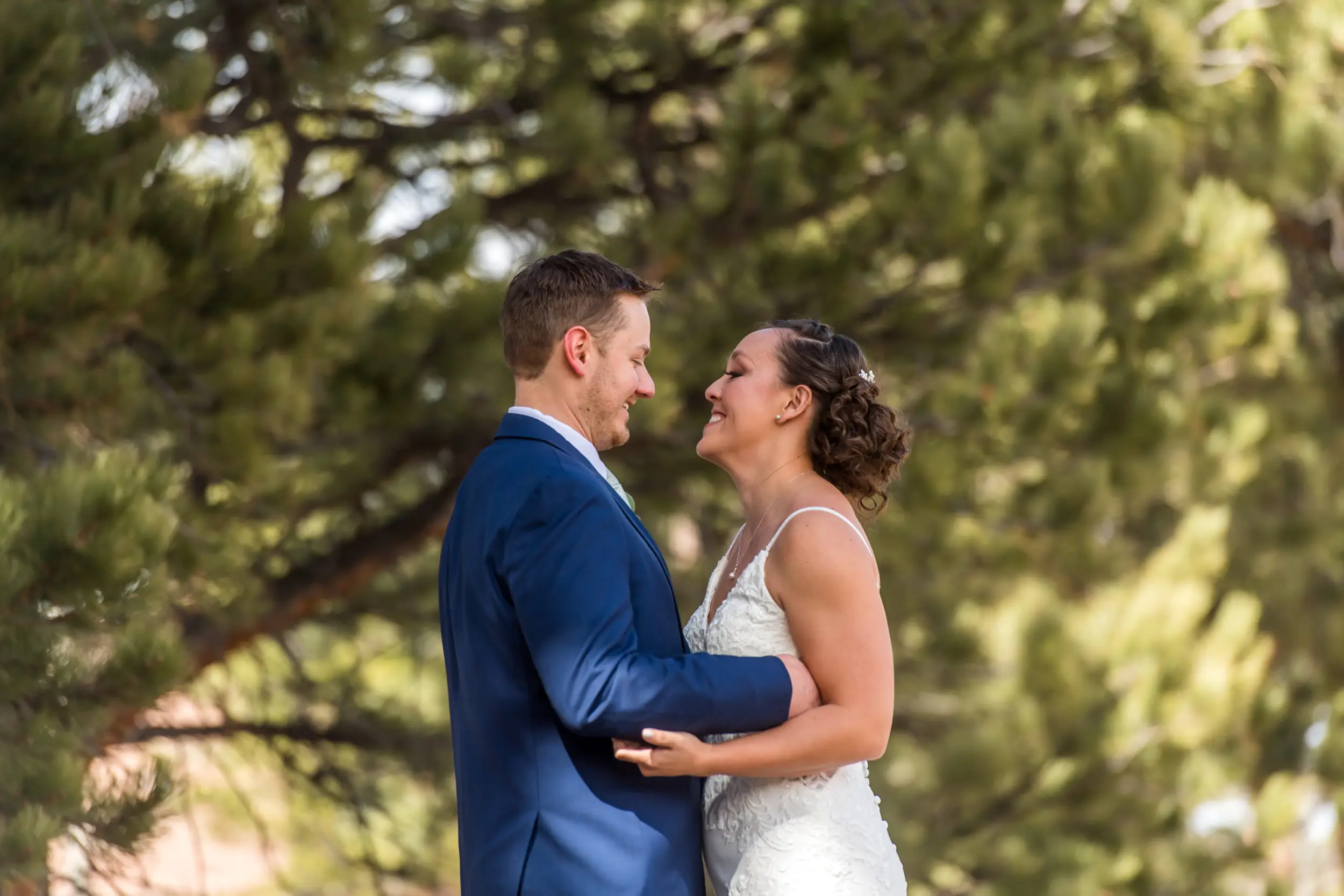The bride and groom first look during their YMCA of the Rockies wedding in Estes Park, Colorado.