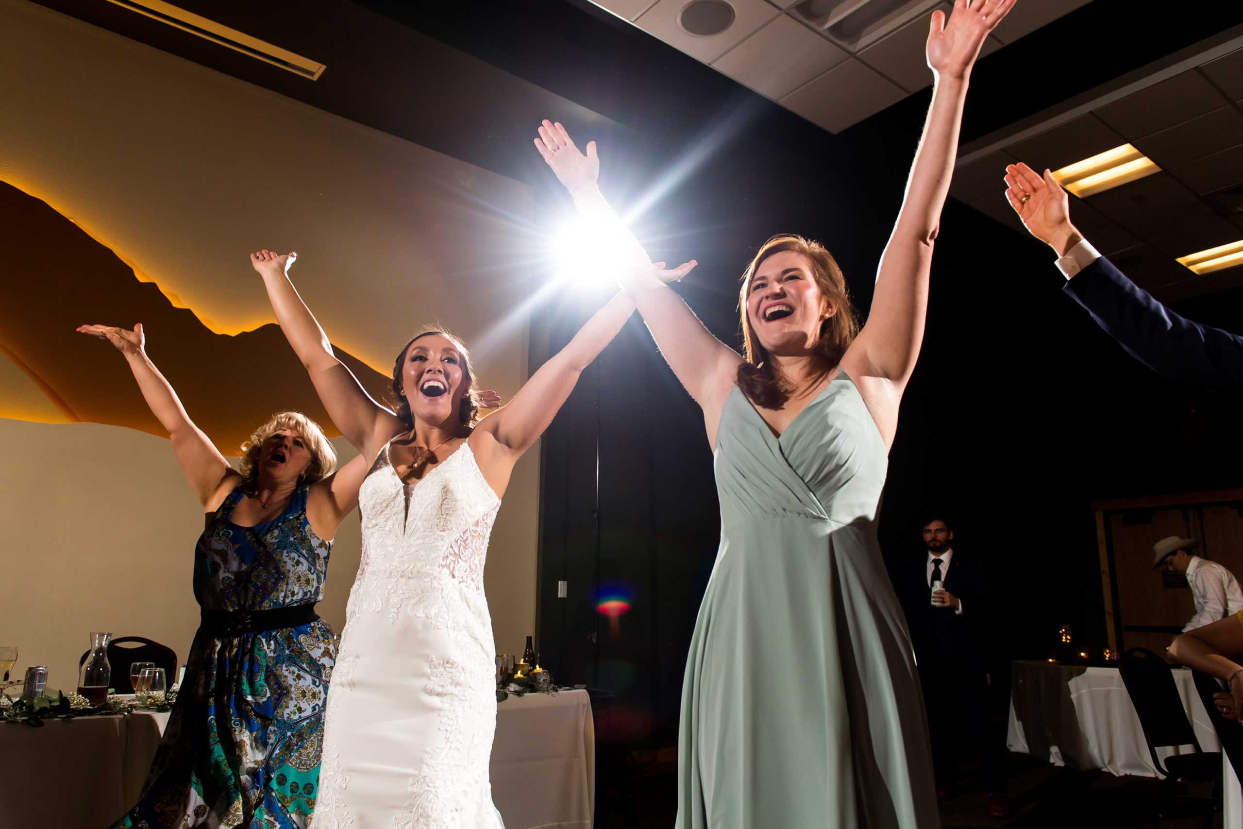 Bride and guests dance during a YMCA of the Rockies wedding in Estes Park, Colorado.