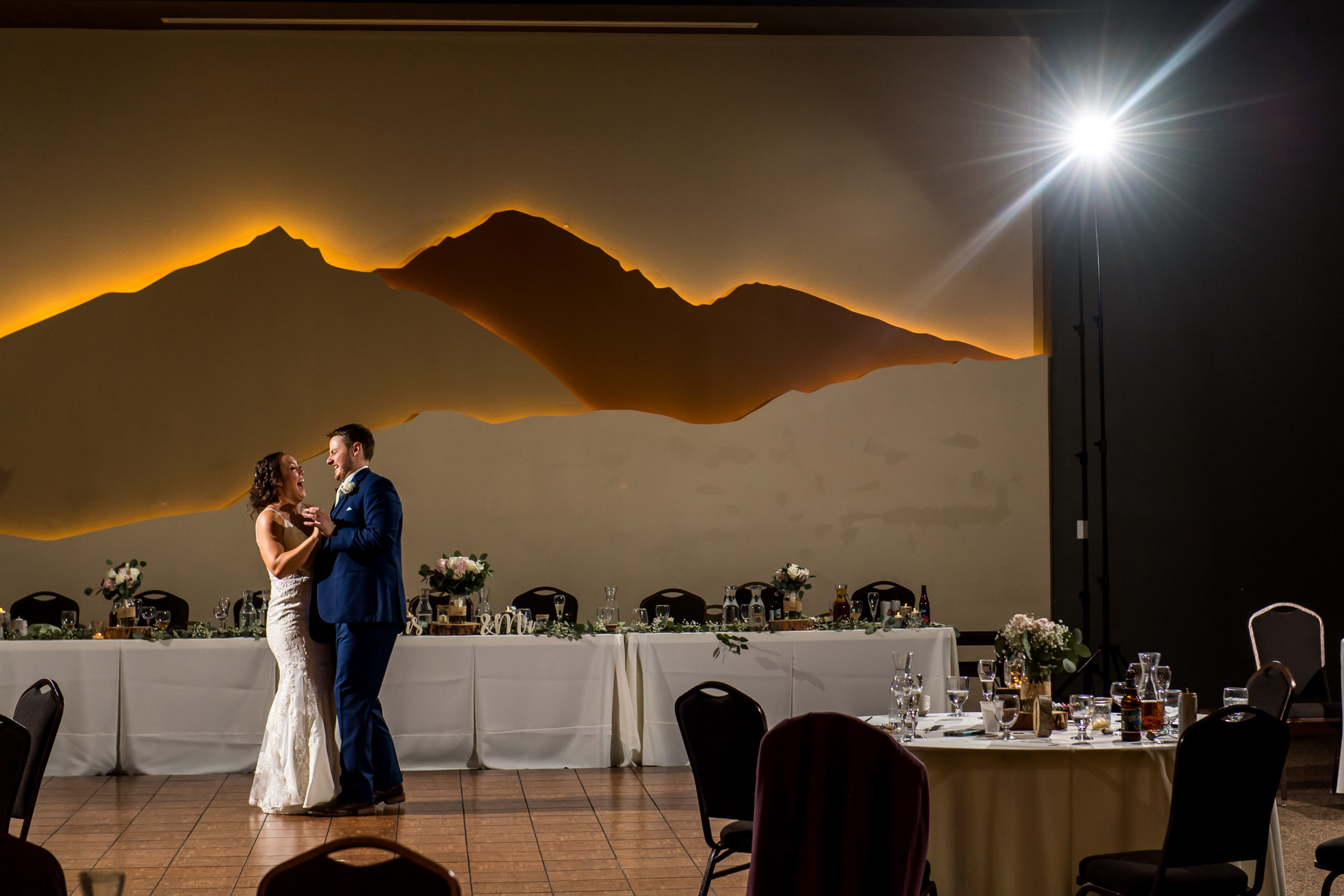 The bride and groom dance during their YMCA of the Rockies wedding in Estes Park, Colorado.